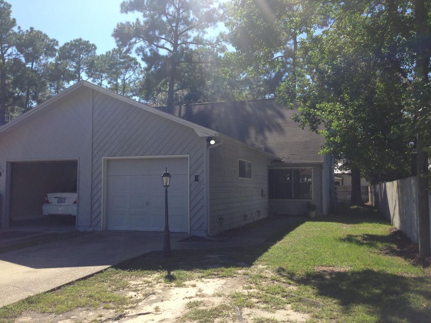End Unit with fenced yard. As you walk into this town home, you are greeted with wood laminate floors throughout the entire townhome. New paint in today's favorite colors. Very functional open floor plan with soaring ceilings in the living room with dining room area. The kitchen has plenty of counter top space and storage room in the cabinets. The additional bedroom is on the first floor, next to the kitchen with a full hall bath. Upstairs there is a loft/balcony area and double doors opening up to the Master bedroom; which is also all wood laminate flooring. The Master bath has a vanity sink and stand up shower/tub. Exterior end unit features a 10 x 10 open patio and fenced back yard.
