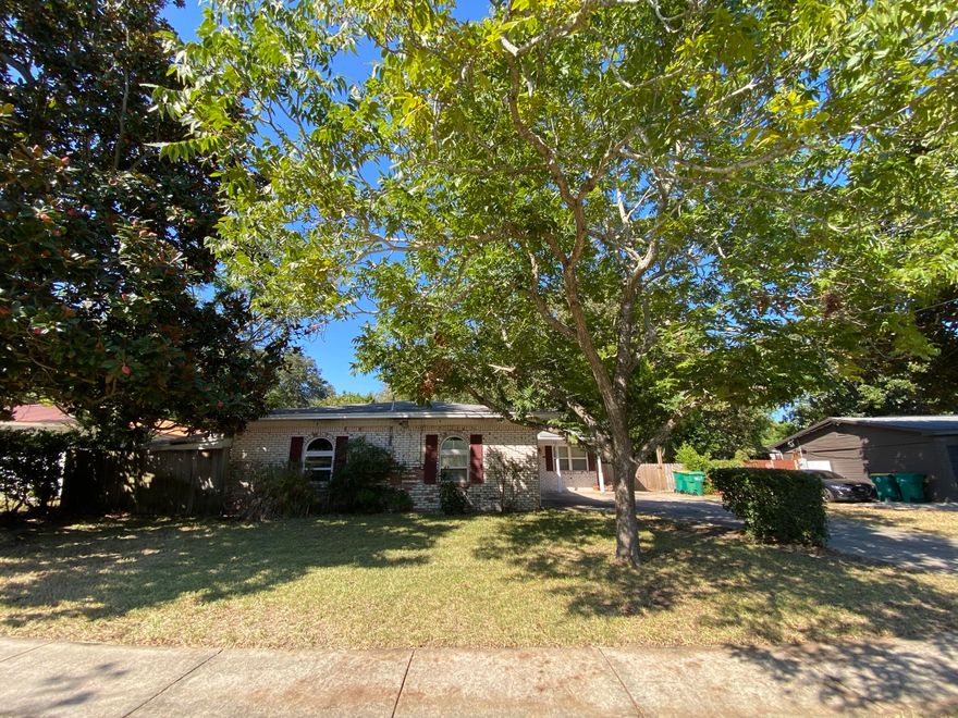 Attention Investors. Brick 3 bedroom 2 bath home in the heart of Destin. Cash purchase required due to older roof, flooring, & aluminum wiring.