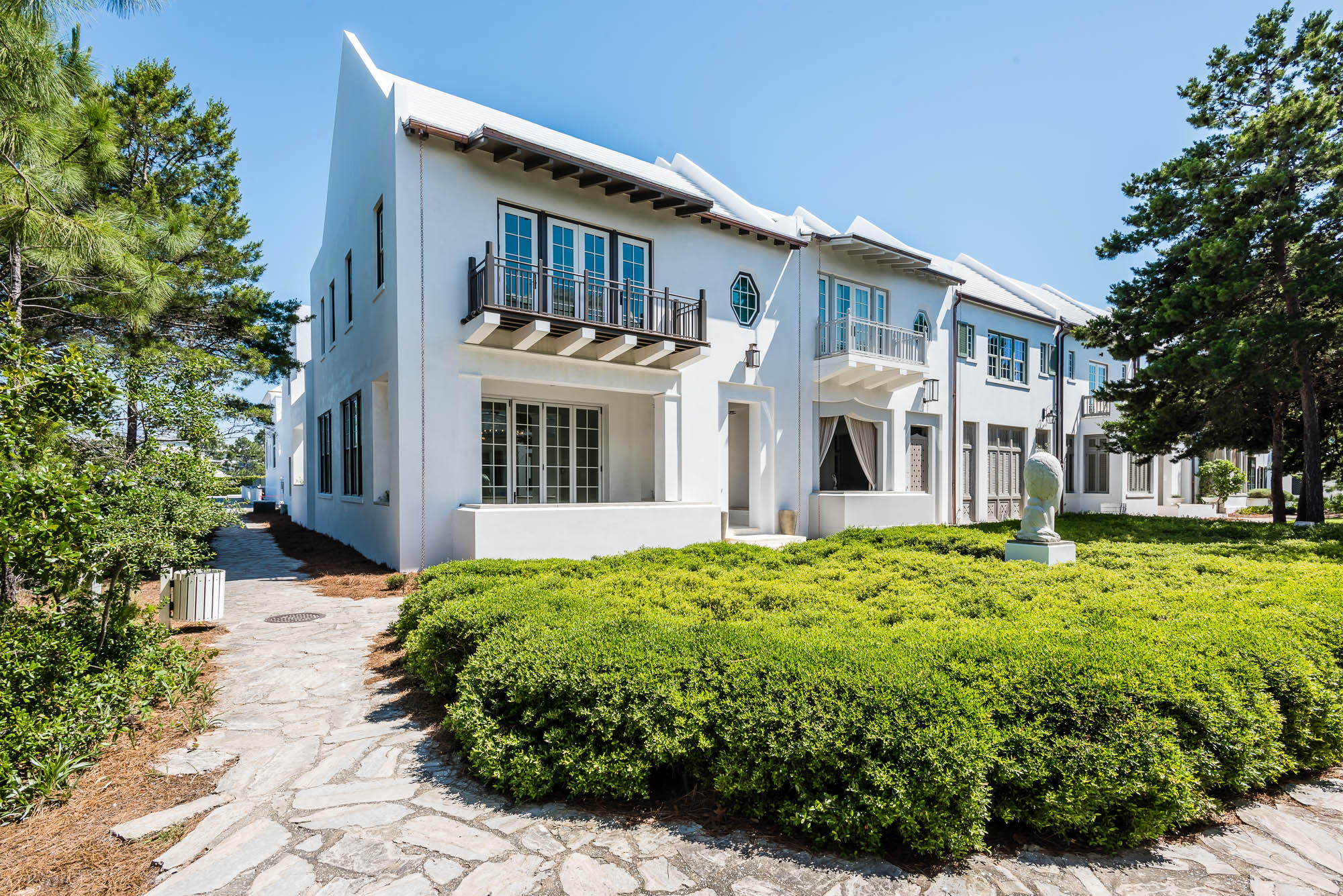 This spacious 3436 square foot custom Alys Beach residence is a part of the architectural vision that has its roots in the style of Bermuda architecture and the courtyards of Antigua, Guatemala. This home was built to evolve, maintain timeless traditions of sustainability all to the highest standards of design and construction. With 4 bedrooms, 4 full bathrooms and 1 half-bath, this residence is just feet from the infamous Caliza Pool and Restaurant and a simple walk to The Gulf Green beach access. This desirable end-cap site, directly overlooks Arboleda Park, and is steps from from the emerging Town Center, serene Lake Marilyn, and Clermont Tennis courts.