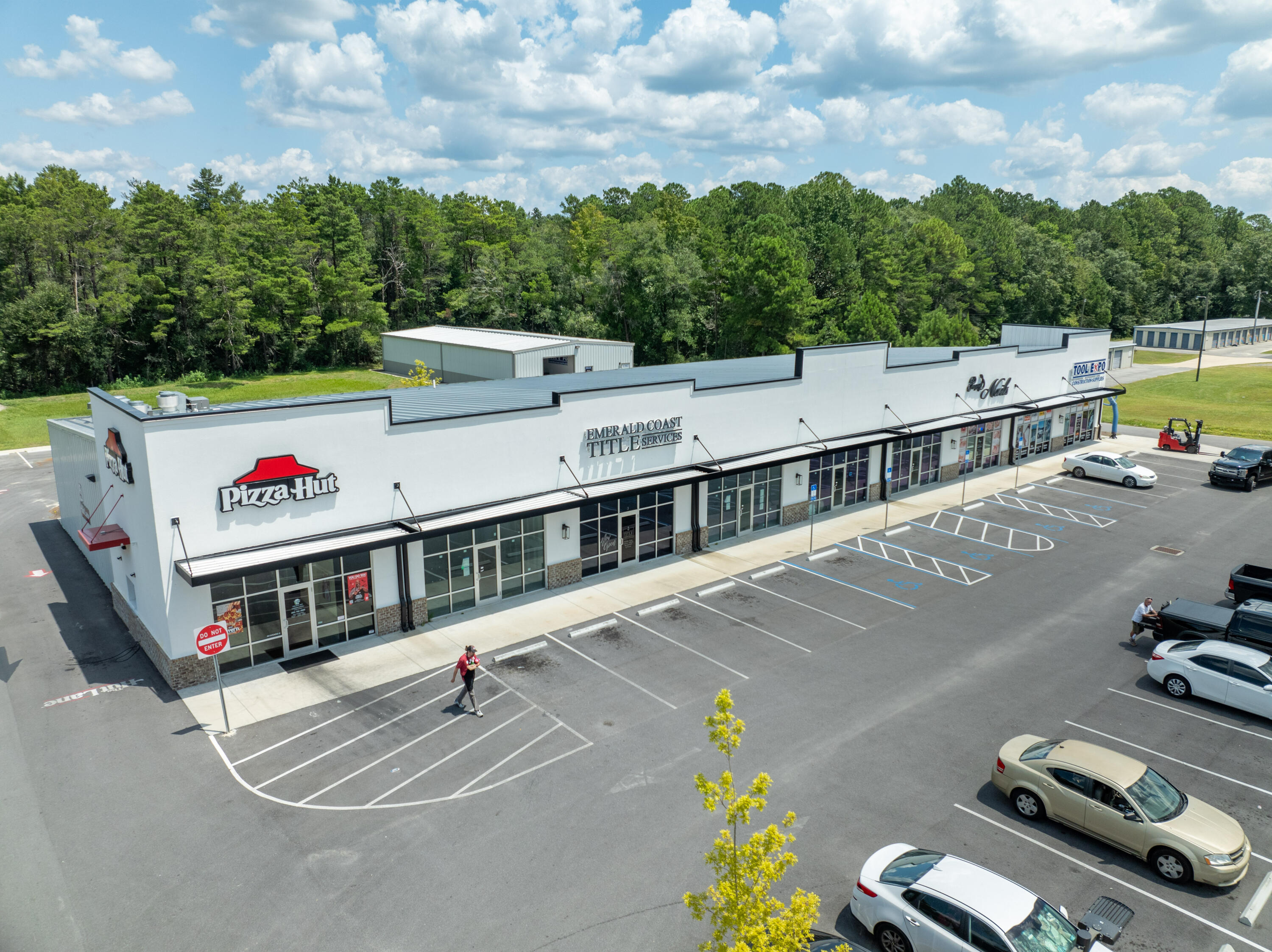 Newly developed inline retail plaza +/-700' west of the crossroads at Highway 331 and Highway 20 in the strongly emerging market of Freeport, Florida. The shopping center displays a modernized image and offers an abundance of parking capacity, as well as favorable flow around the site to Pizza Hut's drive-thru, and to the rear doors of each space, in addition to access of the separated warehouse oriented in the rear of the site, which is occupied by Tool Expo, who is also a retail storefront tenant in the plaza.  Tenants' signs are highly visible, and ingress/egress is favorable.  One space is vacant, which stands currently as a vanilla box ready for fixturing. Please inquire for further details.