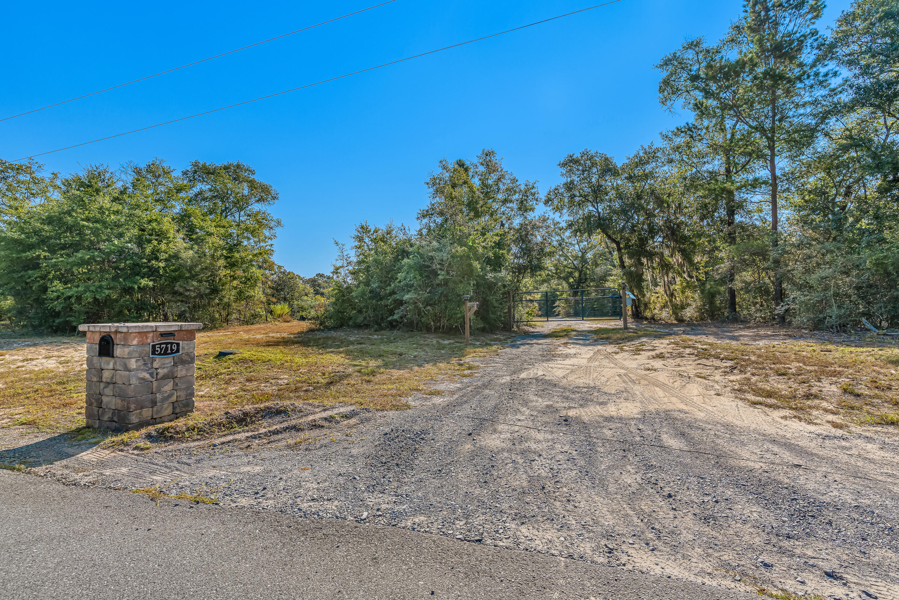 Experience the best of country living on 4.67 acres of thoughtfully prepared land. Blending open, elevated spaces with beautiful wooded areas, this property offers the perfect setting for a custom home, private retreat, or investment opportunity.Essential improvements are already in place, including power, city water, and a septic system designed to accommodate two RVs. A gravel driveway provides a welcoming entry, while a metal storage building offers secure and convenient space for equipment.A spring-fed creek flows through the property and, once restored, will naturally replenish a large pond--creating a stunning focal point and enhancing the land's natural charm. The wooded portions of the property add privacy and character, while the open areas provide ample room for building or recreation. Wildlife, including deer, are frequently seen, underscoring the serene environment.
With its balance of cleared and wooded land, established utilities, and scenic water features, this property is a rare opportunity to build your vision in a tranquil setting.