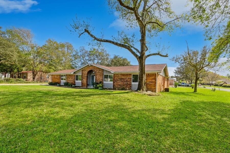 This home checks all the boxes! Starting with the roof which is less than 1 year old (2022)! The large corner lot has so much charm with beautiful oak trees and landscaping. Did we mention the large gunite pool that was resurface in 2021?! It's a beautiful white surface and deep blue tile. Even with the yard having a larger pool it still has plenty of yard space and large concrete area to lounge or hangout! The interior of the home has been updated with new cabinets, flooring, and fixtures. The vinyl plank flooring flows throughout the kitchen and living areas, tile is in the dining & Bathrooms, and NEW carpet in the bedrooms. Great size bedrooms fill the home, multiple living areas, large kitchen, and so much more! Make sure to make your appointment today
