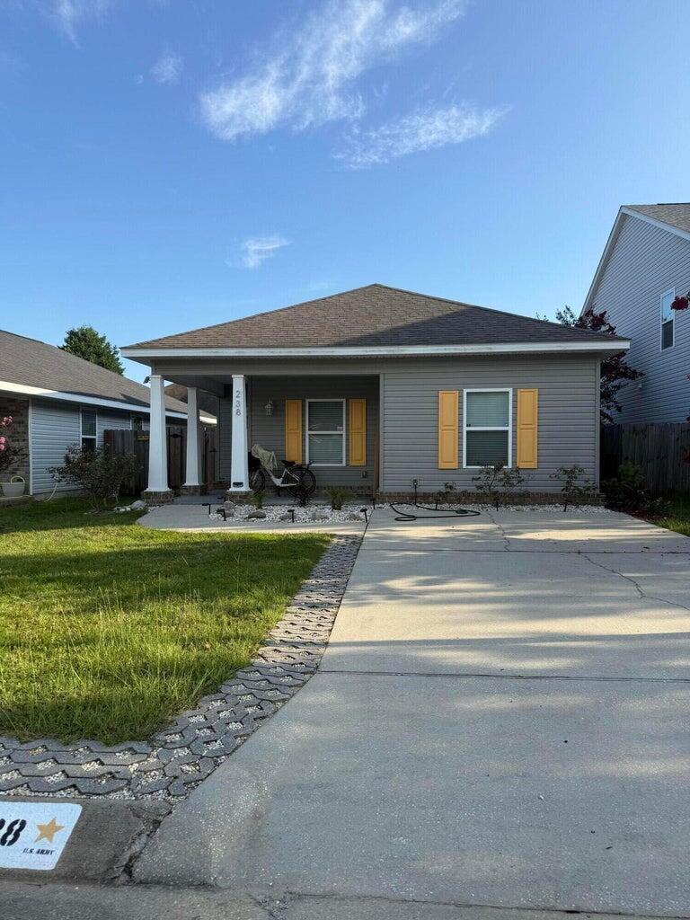 Welcome to this charming 3-bedroom, 2-bath cottage that blends coastal flair with laid-back bohemian style. This home is just minutes from downtown Pensacola, a short walk to the local park and marina, and only a 6 minute drive to the NAS main gate. Step inside to enjoy new flooring (2022), fresh interior paint, new lanscaping, and a new a/c all the updates you need for comfort and peace of mind. The spacious backyard is a true oasis, beautifully landscaped with a shaded seating area surrounded by blueberry and blackberry bushes, a lemon and banana tree and a and a fragrant rosemary bush ideal for relaxing or entertaining.