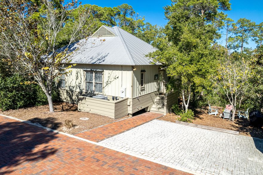 Fantastic beach house located in Magnolia Cottages by the Sea - in the heart of 30A, short distance to Rosemary and Alys Beach. Great investment property with Deeded beach access and community pool! This charming cottage is beautifully decorated, has  oak stained hardwood flooring, laundry room, owner's locker and secluded screened-in rear porch that backs to a private wooded setting. Located on one of the larger lots in neighborhood with some privacy. Closed cell foam insulation blown in sub-floor. Hurricane shutters for all windows, convenient keyless entry and large outside storage shed.  Being offered furnished and rental ready