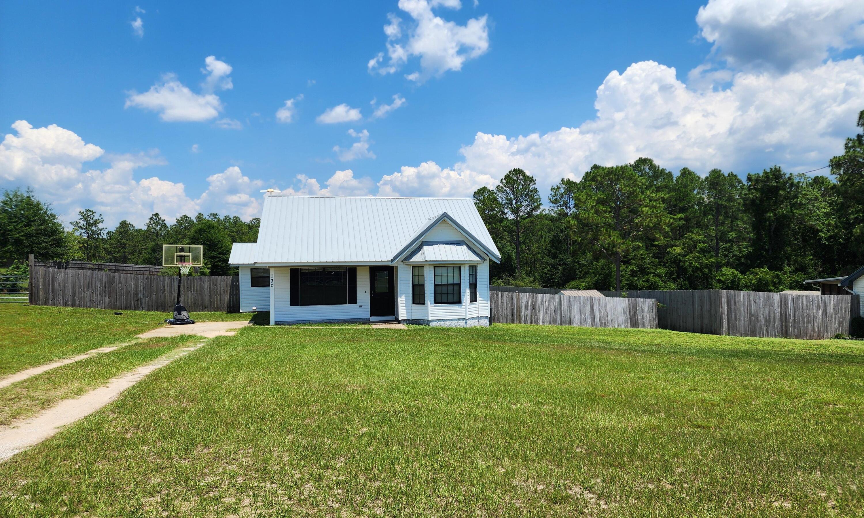 Charming 2 bedroom, 1 bath on a Cleared Acre! This home boasts a cathedral ceiling fresh paint, a new metal roof and a new ac unit!! The Washer and Dryer will convey for the new homeowner if needed. If you are looking to downsize and be cost efficient this could be the home for you! This home is approximately 5 to 10 minutes to town and minutes to Eglin and the Beautiful Beach! Call and schedule your showing appt!