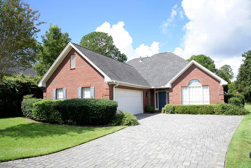 A gracious one-owner home  is tucked a way in a quiet small Bluewater Bay  neighborhood.   Apealing upon entering on the brick paved drive and on into being greeted with hardwood floors, tall, smooth ceilings and deep crown molding.  This was a forever home for the owner and was thoughtfully planned throughout construction by Chateau Builders.  Full of 5' windows front and back with a sunroom to bring the outdoors in.  Loads of storage space easily accessible.   Refrigerator, washer/dryer do not convey.