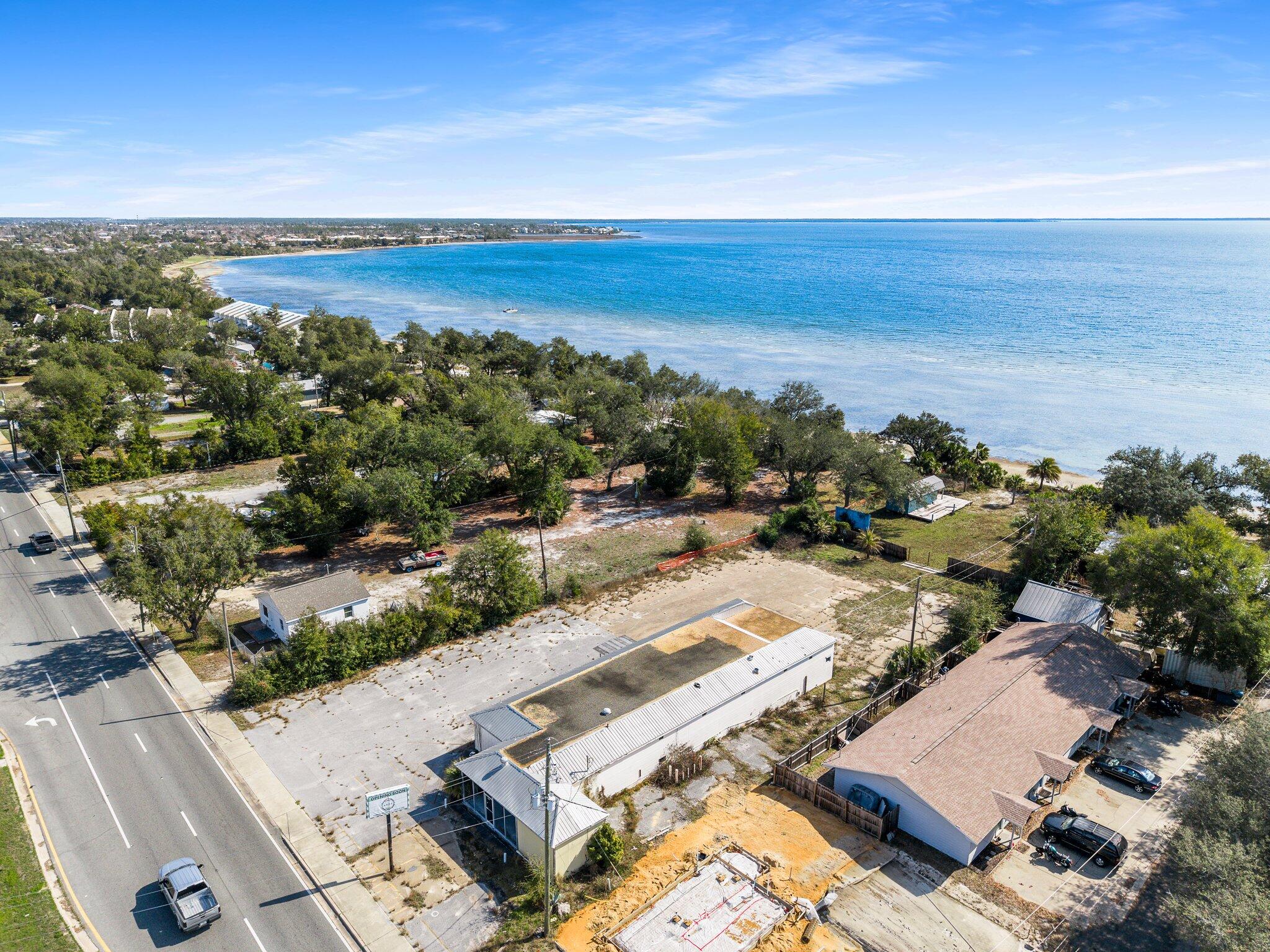 Waterfront Commercial property.  Over 110' of Hwy 98 frontage in Parker.  One older building and a small separate service building is currently on the site.  Partially paved parking area.  MU-2 zoning allows for multiple housing up to 25 units/acre, restaurants and a multitude of uses.  Parker is growing fast this is an excellent chance to get high-density property for a bargain price.