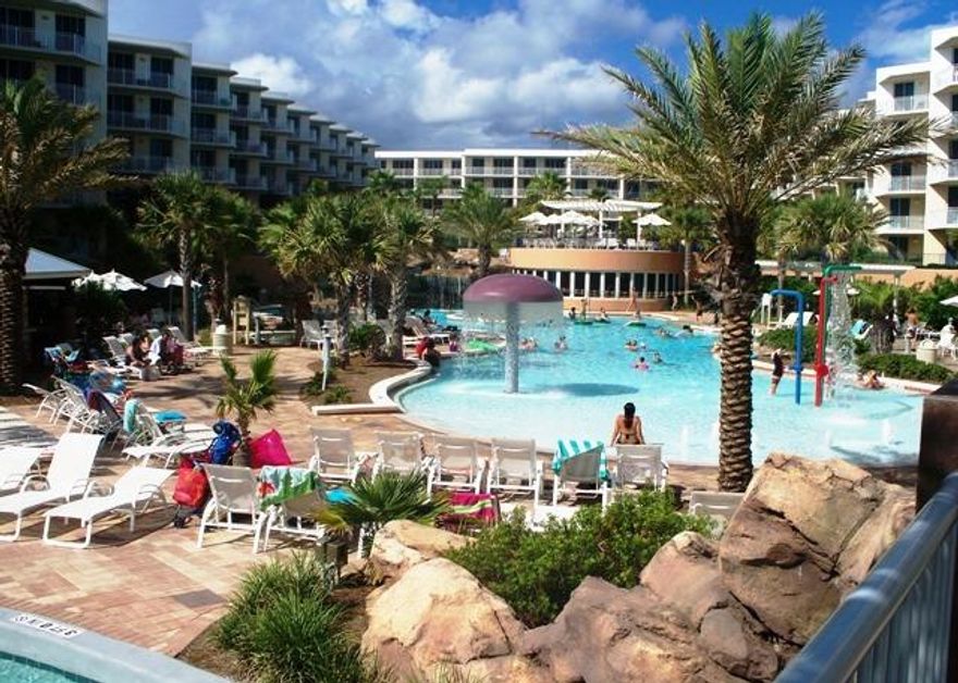 The pinnacle of Gulf front living, this stunning 2 bedroom + bunks, 2.5 bath condo at Waterscape (Building 1) is truly deserving of the term masterpiece. Imagine one of the area's most luxurious condominium complexes with every amenity desired including 490 feet of pristine beach front. When initially designed, every condo was angled to maximize the best Gulf of Mexico views through floor to ceiling doors and windows. The remarkable courtyard features 3 pools, 2 hot tubs, waterfall and a famed Lazy River that you have to see to believe! There is also a Children's play area with splash pad and water activities, game room, BBQ grills, conference facility, fitness center and covered garage parking.