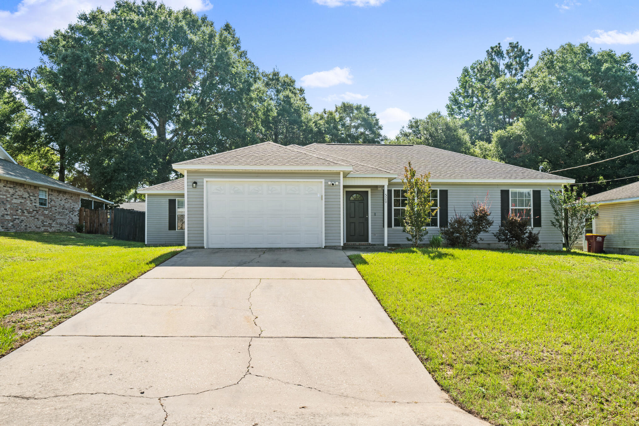 This cute Crestview home features 3 bedrooms and 2 bathrooms with a split floorplan and huge private backyard with enough space for a pool, play sets or for furry friends to run around.  Throughout the home is LVP flooring and carpets in the bedrooms.  The kitchen features gorgeous granite countertops, white cabinets, pretty backsplash and stainless steel appliances.