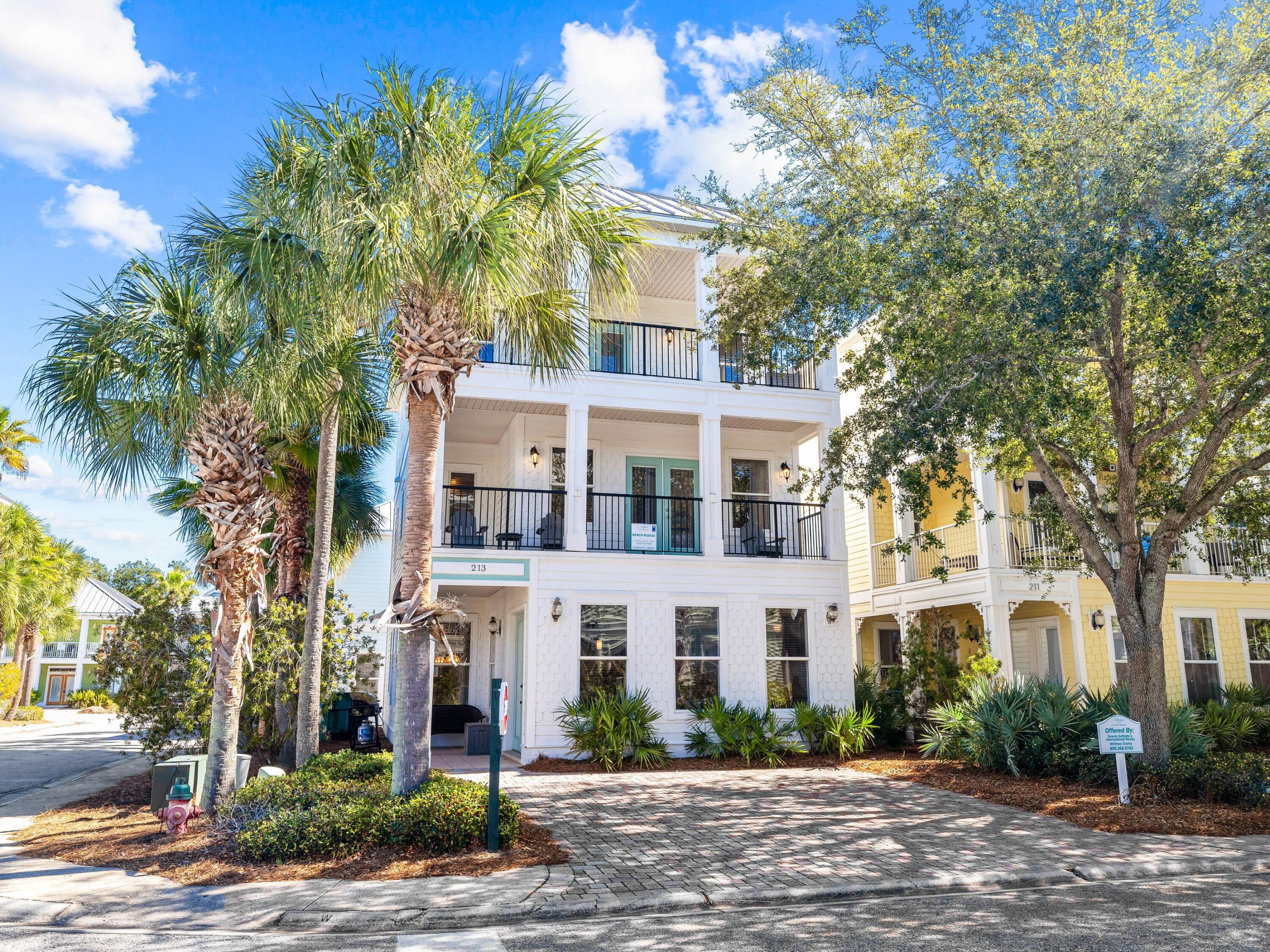 Three floors of luxury living await at this Caribbean-inspired beach house in the Village of Crystal Beach. Paved parking, views of the nearby pool and no neighbors to the left give this vacation home an enviable amount of privacy. Wood features high in this well-maintained home that shows like new with updated furniture, fresh paint, new rugs and new smart TVs in every room. The updates continue in the open-concept kitchen which boasts all new stainless steel appliances including the stove, microwave, dishwasher and refrigerator. A new washer and dryer are tucked away in the laundry. Crown molding adds a touch of elegance to the spacious first-floor sitting room, which has ample space for social gatherings around the TV. The adjoining kitchen is well laid out with wood cabinets and black granite countertops extending onto the counter for breakfast and casual mealtimes. Beyond the kitchen, the formal dining room is perfect for leisurely dining and entertaining. Two master bedrooms on the second floor are sure to delight with swanky bathrooms boasting whirlpool tubs, double vanities and tiled showers. Three additional guest beds and two more bathrooms are located on the first and third floors. Well-appointed wet bars with fridges and microwaves are thoughtfully located on both the second and third floor, allowing family and friends to help themselves to drinks and snacks throughout the day. Covered porches on every level provide ample space to spread out and find a quiet place to read or chat. The community has an outstanding array of amenities including a lagoon pool, waterfalls and an island hot tub all just a short walk from the door. Multiple grills are available for partying in the gazebo area and there's a seasonal shuttle service for easy access to the white sandy beach.