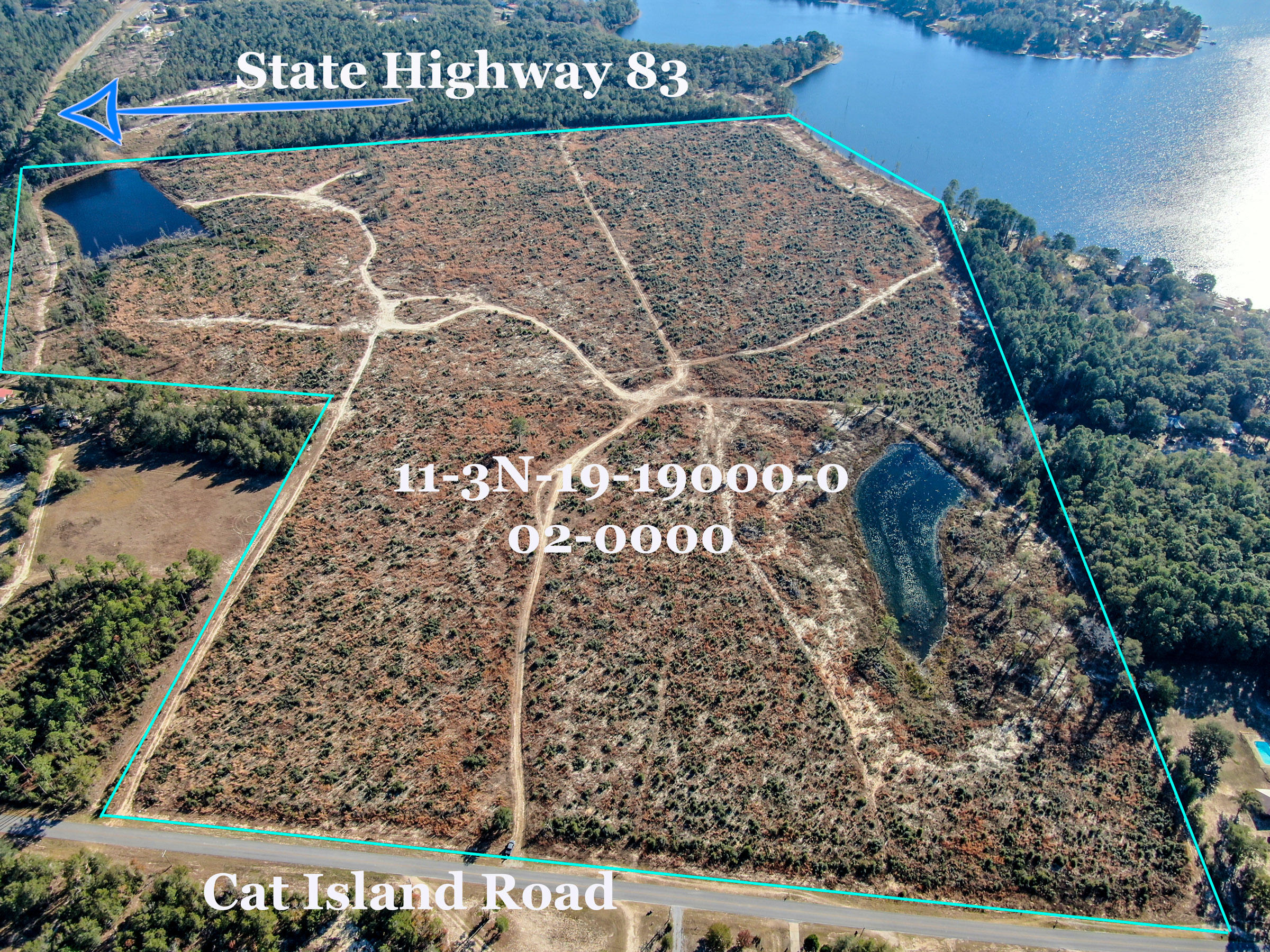 104 acres . Paved road frontage on Hwy 83 and Cat Island Road. 690 feet of waterfront on Lake Juniper plus two private ponds on the property. Zoned urban Residential ( 4 units per acre if sewer is available. 2 units per acre if no sewer) Lake Juniper is a 625 acre state managed big bass & bream fishing lake. ( 17 pound large mouth bass is the lake record) The subject property is only 4 miles North of downtown historic Defuniak Springs ( voted best small town in the state of Florida). 95% of property is high & dry. The property was replanted 3 years ago in long leaf pines. This is a one of kind property. This 104 acre parcel may be the last undeveloped large tract of land in Northwest Florida that is located on a state managed lake like Lake Juniper.