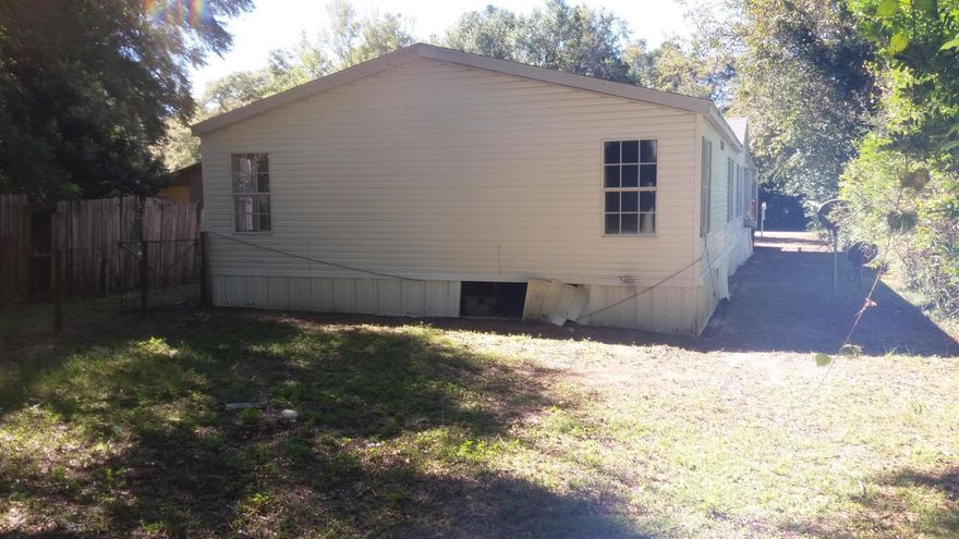 Here is your chance to own a fixer upper located very close to the heart of old downtown Crestview. This 1997 mobile home boasts 4 bedrooms, 2 bathrooms, and is over 2,000 sq ft. The property is a fixer upper and will need AC, paint, new flooring, appliances, and light fixtures. It would make a great rental property after the renovations. Location is very close to Highway 90 with restaurants and shopping just around the corner. This home is being sold AS-IS and will not last long at this price.Properties this size are selling on average for 70K when renovated.