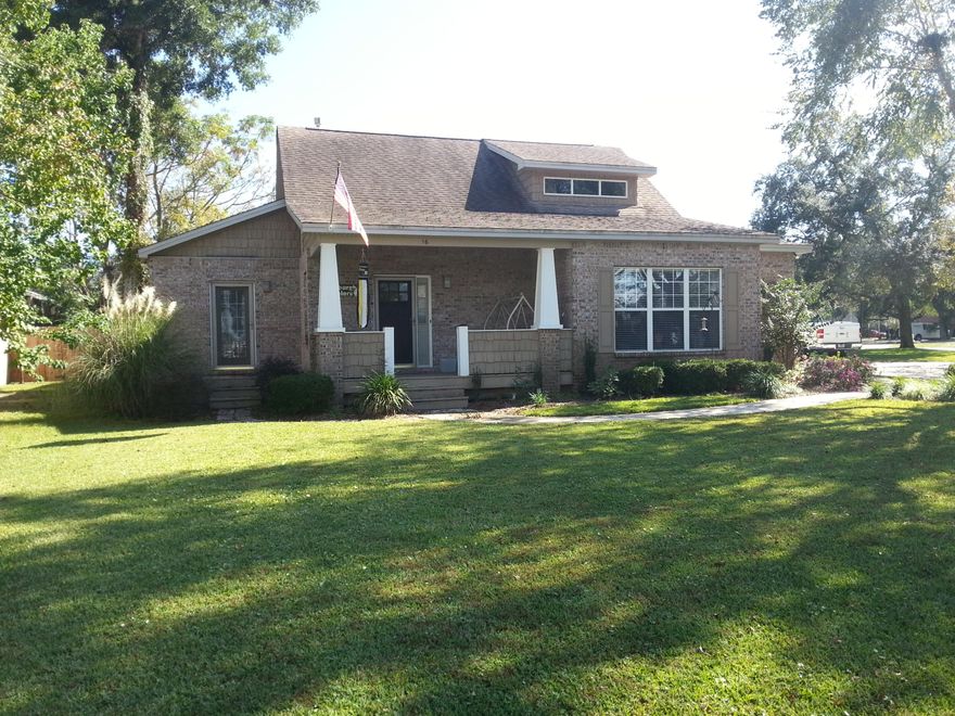 SHORT SALE. Charming 2630 S.F. All brick custom built home with many unique features. Cozy front porch greets you with it's Craftsman style columns. Take a drive down Shalimar Dr. to enjoy the water view and the large oaks with Spanish moss. Large great room with open kitchen & dining, 3 BR, 3 BA, Den, Butler's pantry & laundry room. Custom kitchen with stainless steel appliances, gas range. Walk in closets (2 in Master Bedroom) & plenty of storage space. 2nd floor bedroom has a private bath (great for guests). Custom interior features are walnut paneling and crown moulding in dining room, 9 ft. ceilings throughout, built-in bookcases & columns, all adding to the Craftsman feel of the home. 1st floor room is designed for a professional office with a separate entrance.