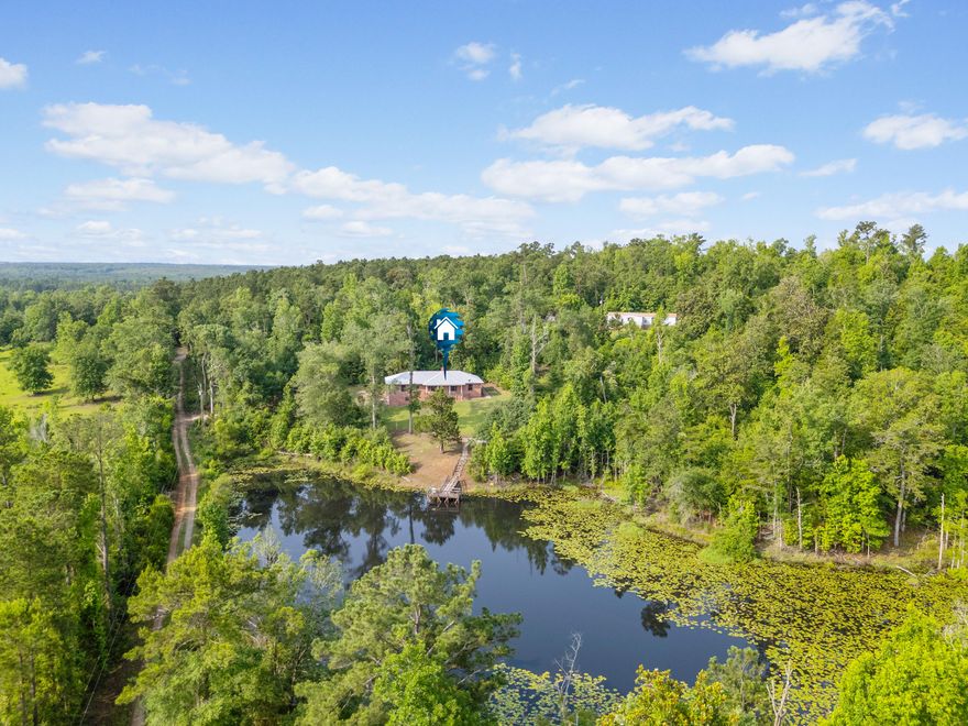 Lowest Price - 50 Acres with Stunning Features! 2 Parcels (10 acres/home & 40 Acres Land)Looking for an incredible property at an unbeatable price? This sprawling 50-acre estate is ready for the right buyer! &#127969; 2200 Sq Ft Brick Home - Just needs cosmetic updates! &#127966; 1.5-Acre Bass-Fed Pond - Complete with a dock for fishing or relaxing. & Attached 900 Sq Ft Garage - Extra space for storage or projects. & 3 Beds, 2.5 Baths - Spacious 2100 Sq Ft home. & Metal Roof & TLC Needed - A solid structure with potential! Includes 2 Parcels: & 10 Acres with Brick Home - FOLIO #00000000-00-0043-0003 &#128205; 40-Acre Parcel Behind - FOLIO #00000000-00-0077-0000& Sold As-Is - Priced to Sell! Don't miss this rare opportunity!