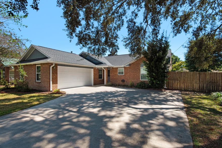 NO HOA!! New 2025 Roof & sky light, exterior paint, and custom primary shower. FANTASTIC Niceville Location. Convenient to Eglin, Duke, Hurlburt and Destin's white beaches. This 3 bedroom, 2 bath home offers LVP flooring, and neutral paint. Quartz kitchen counters with deco tile backsplash. When quiet time is needed away from the main living areas this split bedroom floor-plan is a wonderful solution. Looking for a private outdoor space, this large lot includes a fenced back yard and a patio area off the main living. The garage not only allows for vehicle parking, but also offers workbench space and storage. The side yard gives access to park all your recreational vehicles.  This home is a must see in the heart of Niceville. 2023 Water Heater, New windows in 2009.