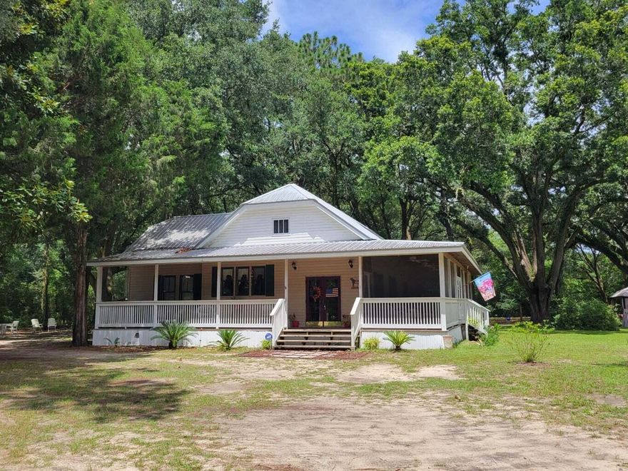 Florida Southern Cottage style home with tall 10 feet interior ceilings and Large L shaped outdoor partially screened Porch area. 2359 sf under roof total. 2 large bedrooms and 2 baths.Laundry room is in home in back area next to master room and access from screened porch area as well. There is a large Den area or Formal entry that is a host that could easily be used as an addition Bedroom or office. Also there is a large unfinished area in the attic that possibly could be used for extra storage . Beautiful property with large oaks surround and very charming. Owners are looking for well qualified tenants , minimum credit scores will apply.Easy application process. There are pet restrictions and limits.