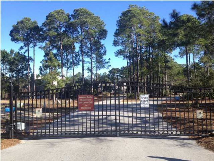 Beautiful home-site with 185ft on lake in gated neighborhood of Somerset Bridge At Seagrove. Build your dream home or hold lot as long-term investment as there are NO HOA FEES!! Water & Sewer taps have been paid in full. Beach Access is at the end of the road. Short walk/bike ride.