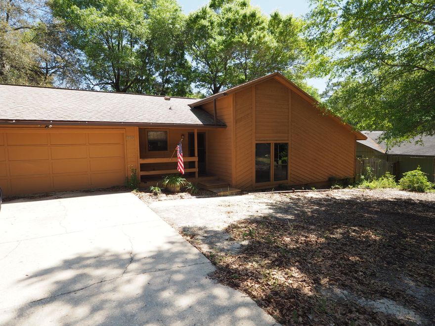 Great home with tons of upgrades. Located on a quiet cul-de-sac. beautiful kitchen with granite counters, large tile floors, stainless steel appliances, and modern lighting. newer carpet in bedrooms - garage has been modified to increase living area, but still give you some garage space. nice porch in the back with a fenced in yard and lots of trees on this .28 acre lot.