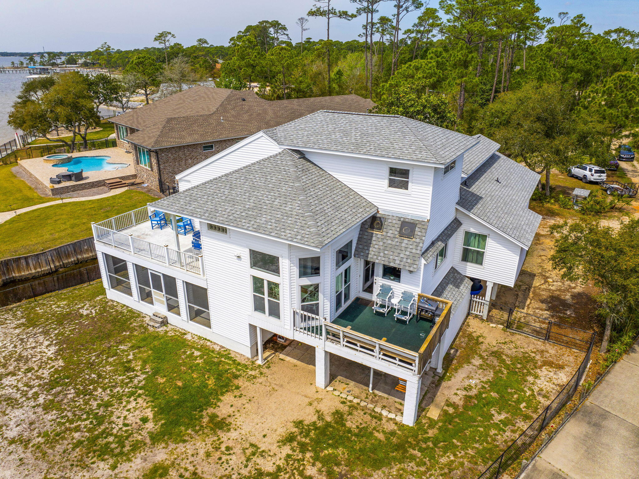 MOTIVATED SELLER!! PRICE REDUCED!!Escape to your own private oasis nestled along the tranquil shores of the Santa Rosa Sound with breathtaking sunset views. This home offers panoramic views of the sound and crafted with attention to detail. Timeless charm abounds this home with large windows and high ceilings to maximize natural light and showcase the irresistible views. Embrace the Florida beach life by paddle boarding, fishing, or take your boat 10 minutes to crab island or 30 minutes to Pensacola. With Deep water access year round your endless summer awaits. This home boasts lots of storage and a beautifully updated kitchen perfect for entertaining guests or a cup of coffee in solitude.
