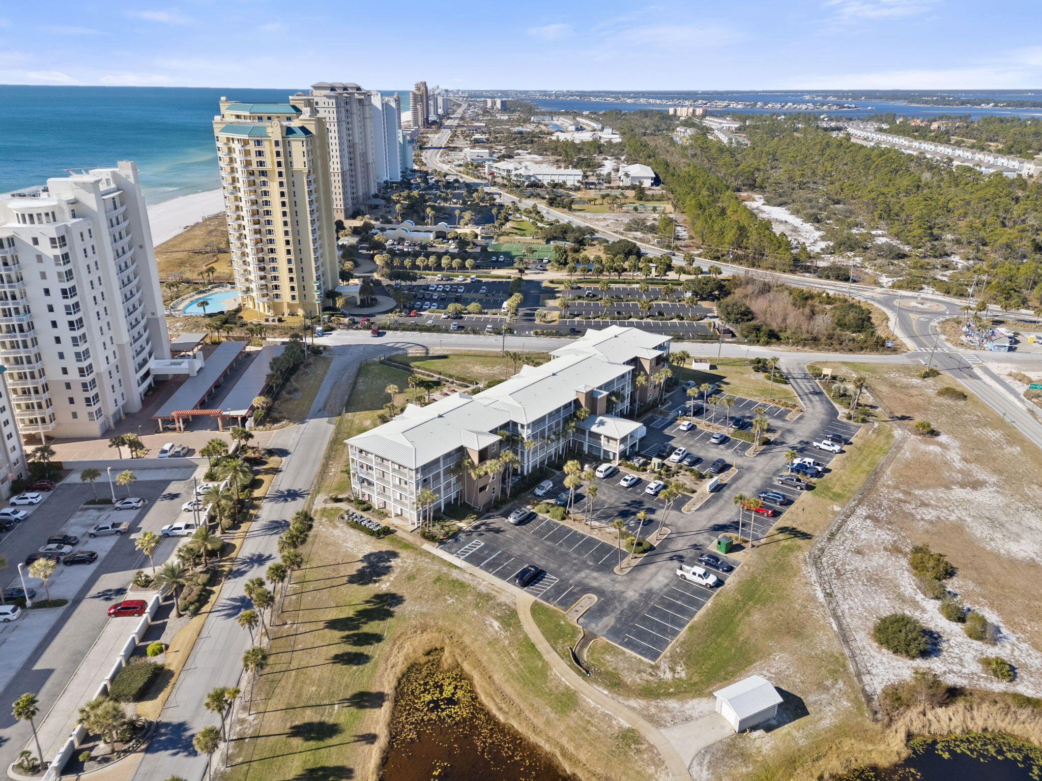 Step into the ultimate Gulf Coast getaway with this NEWLY fully furnished 1-bedroom + BONUS BUNKS condo at Grand Caribbean! Designed with a unique floor plan, this charming beach retreat features two twin bunks in the hallway, making it ideal for a relaxing escape or a lucrative rental investment. Perfectly elevated on the 3rd floor, this unit boasts prime balcony space with scenic Gulf views and a fantastic location just across the street from public beach access. Inside, you'll find gorgeous matching granite countertops in the kitchen & bath, updated tile flooring throughout (no carpet = no sand tracking!), and a stylishly updated walk-in shower. A newly added bedroom closet enhances storage, while the tasteful coastal dA(c)cor in gray & blue hues completes the coastal look. With a new wat