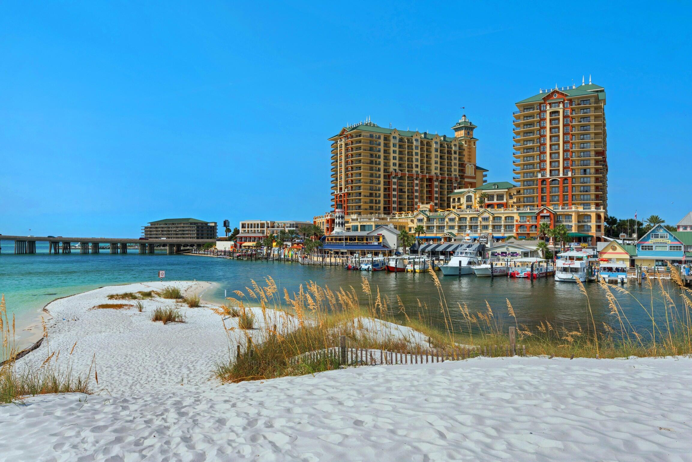 WATERFRONT LIVING IN DESTIN! Beach Luxury life has arrived. From multiple private balconies, soak in the panoramic views of the beach, The Gulf of Mexico, East Pass, the Bay, and the world famous 'Crab Island'! This spacious and stunning 3 bedroom unit is stunning from wall to wall. The kitchen features granite countertops, stainless steel appliances, a gorgeous backsplash and custom cabinetry. You'll love having 2 King master suites and NO CARPET! Italian tile and LVP flooring throughout. Just steps away you will find Harborwalk Village, home to numerous nationally-renowned restaurants, waterfront shopping and nightlife galore. Relax around the large zero entry swimming pool, hot tub + more that all overlook the beautiful Destin Harbor. You're just steps away from everything. HarborWalk Village offers activities and entertainment for all ages. For the land lovers, the interactive kids zone, zip-lining above the crowds, art galleries and seasonal festivals are sure to keep you busy. You'll never have to leave the property with The Grande's indulgent amenities including heated pools, a luxury spa, a fully equipped gym and sauna, a delicious onsite restaurant that provides 24 hour room service and much....much more! Located directly across the street from one of Destin's favorite restaurants - McGuire's Pub.
If your heart lies with the crystal white sandy beaches, enjoy the Grande's private beach and rest next to the sparkling emerald green waters!