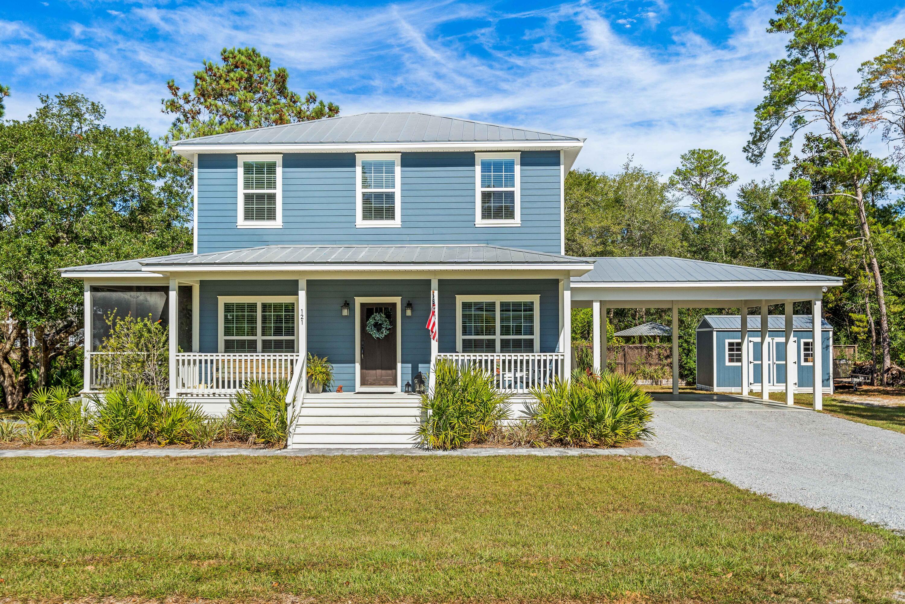 Introducing: 121 Carlos Court. A custom 2310 sf home featuring 3 BD/BR, bonus room, office and surplus of storage space. This wonderfully appointed home is nestled on over a half an acre close to Eden Garden State Park in Point Washington- offering a peaceful escape all within minutes of the white sandy beaches, fresh seafood restaurants, and shopping on 30a. A charming front porch invites you into a spacious and open floor plan featuring plenty of windows, an abundance of natural light as well as views of the beautiful wooded surroundings. The spacious kitchen with quartz countertops and stainless steel appliances leads to a screened in outdoor porch where you can enjoy the peace and quiet of this serene and private setting. The backyard provides an underground pool, a beautiful