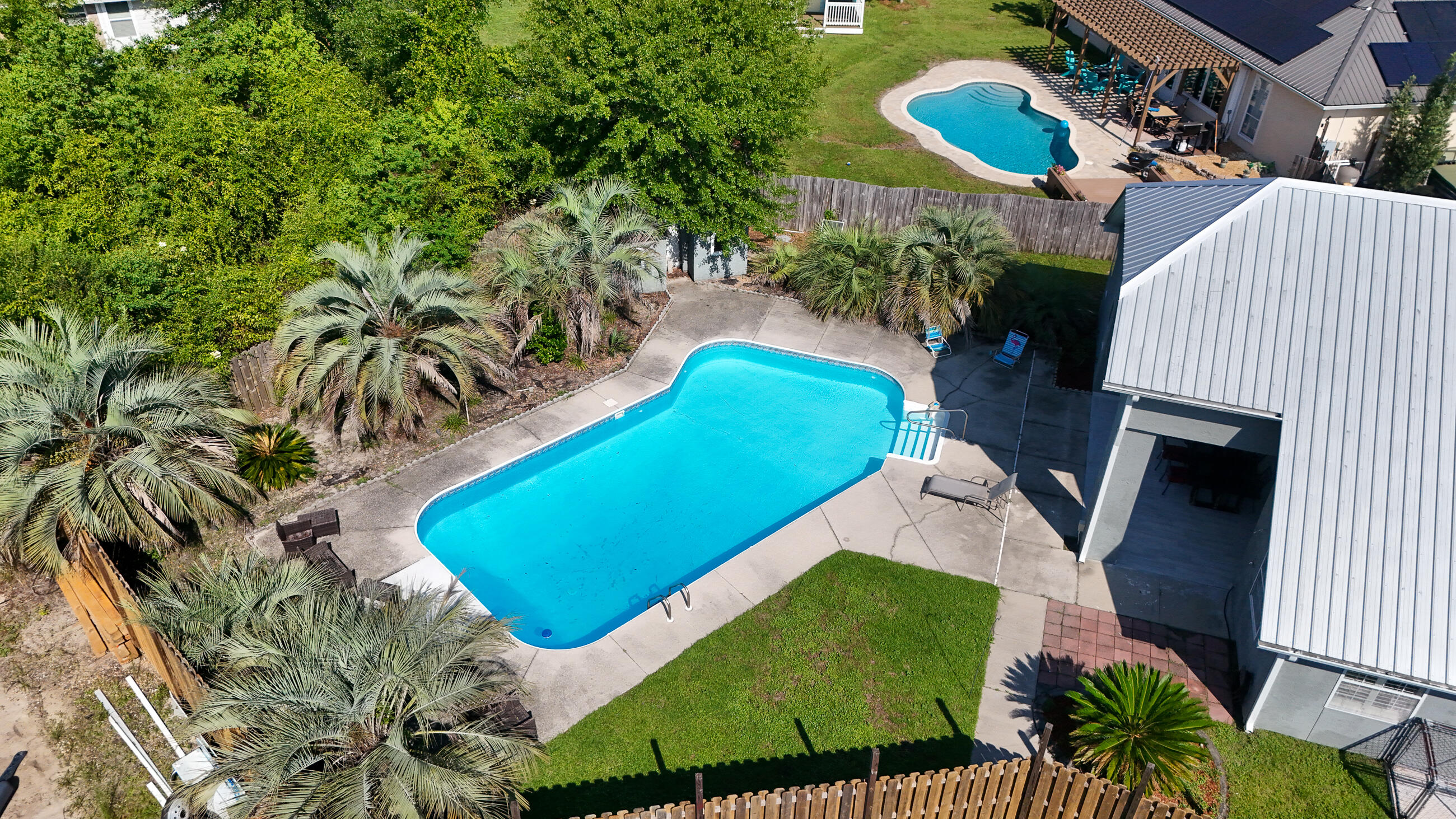 Investor-ready home in desirable Mowat Highlands. No HOA and short-term rental friendly! Leased through March 2026 at $2,600/mo with an estimated 8% cap rate, this property offers solid income now and flexibility later. Set on a .43-acre cul-de-sac lot, with private fenced space for RV, boat or trailer storage. Enjoy the in-ground pool with a brand-new filter and relax under the covered lanai. Inside you'll find 3 beds, 2 baths plus a converted garage with A/C, ceramic tile floor and built-ins -perfect for an office, studio, or guest space. Garage door remains for optional parking. A rare find with rental flexibility and lifestyle appeal! Open House June 11, 4-6pm , June 13, 11am-1pm.