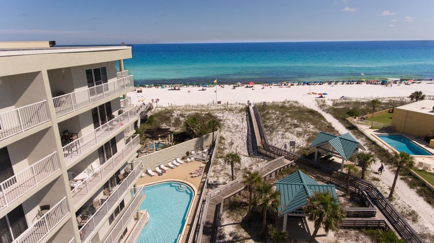 BACK ON MARKET!! Buyer financing fell through.VA Approved! Don't miss the opportunity to own this beautiful unit located right on the Gulf of Mexico. This is the larger 2 bedroom 2 bath floorplan offered at Seacrest. The open, spacious floorplan has gorgeous bamboo floors and includes a 30' balcony with views of the Gulf. This unit has been used as a second residence and has never been placed on the rental program by the current owner. It also comes with a reserved, covered parking space. Seacrest offers low HOA dues, indoor/outdoor swimming pool, fitness center, basketball court, tennis, shuffleboard, meeting room, picnic area with BBQ, direct beach access, and an on-site rental office. Call today to schedule a private showing.