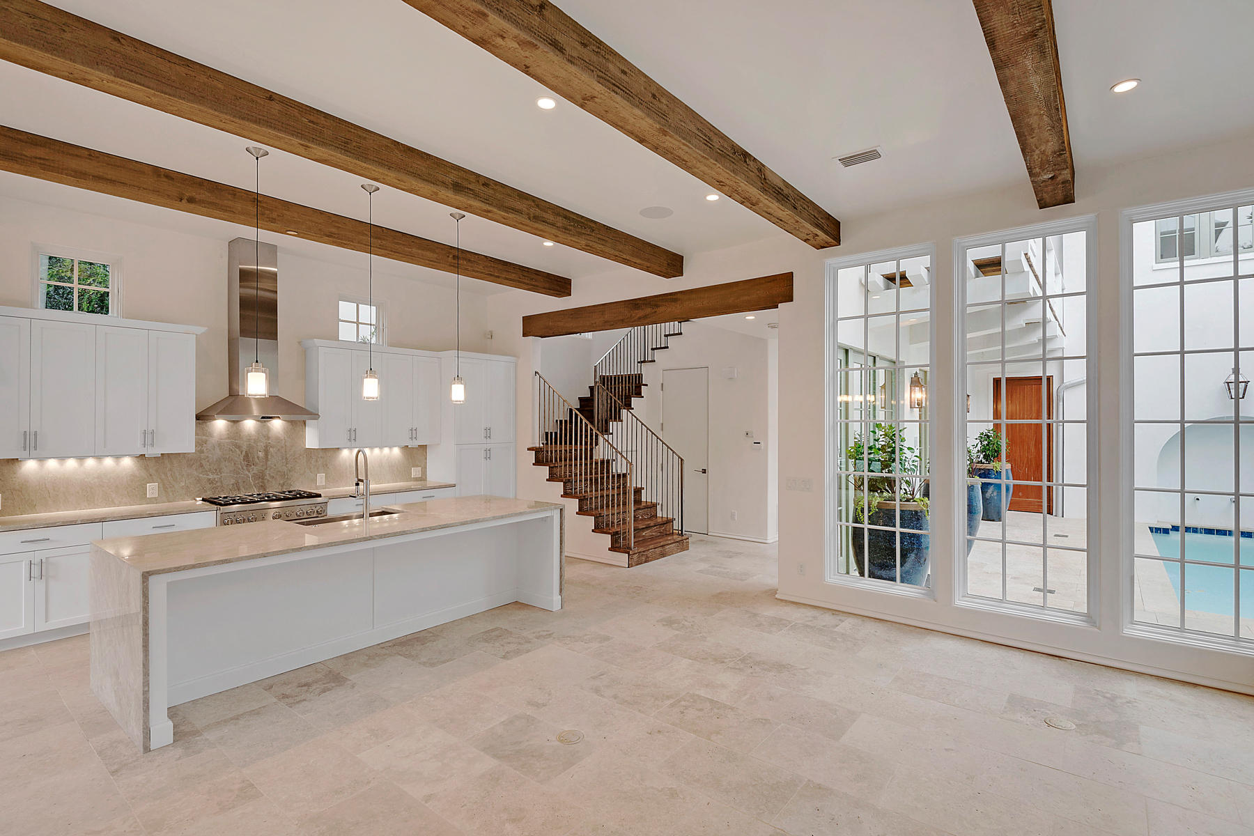 On the desirable east end of Scenic Highway 30A, in the mature and almost entirely built out new urbanism community of Rosemary Beach, new construction as found in this park side home rarely comes available. Built of concrete block near Cabana Pool, the main house and carriage house of The Cabana II envelope a private courtyard with pool and built-in grill. Each bedroom offers an en suite as well as a large closet, making it well suited for extended stays or full-time residency. Over the two-car garage is a spacious carriage house. A cathedral ceiling accentuates the spaciousness of its open living areas that include a full kitchen. Though connected with the main home by the second floor courtyard balcony, the carriage house features a private entry, making it ideal for hosting guests.