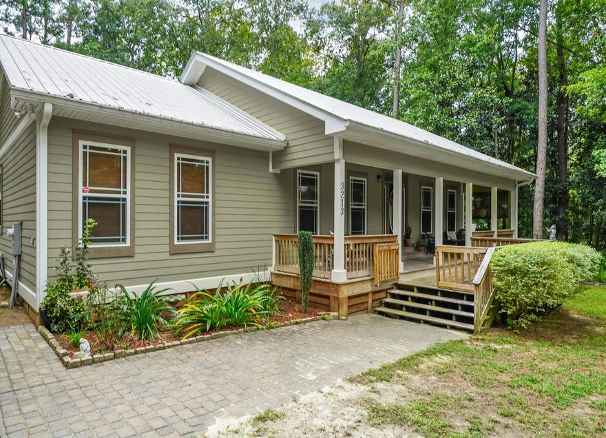 Beautiful 3/2 custom built home with 480sq. ft. workshop on 1 acre! NO HOA! The exterior features a large covered front porch 32X8. The first thing you will notice when entering the home is the beautiful hardwood floors, cathedral ceilings in living room and a large new gas burning fireplace! This split floor plan has an open living room and kitchen. The kitchen and dining area have tiled floors with tiled countertops and custom cabinets The laundry room is located off of the kitchen with a back door to the 14X16 deck. The master bedroom is very spacious with master bath featuring double vanity sinks, large whirl pool tub, separate shower and his and her closets. The 480 sq. ft. workshop is perfect for the handyman or as a man cave! This home is very private and has it all! Call today!