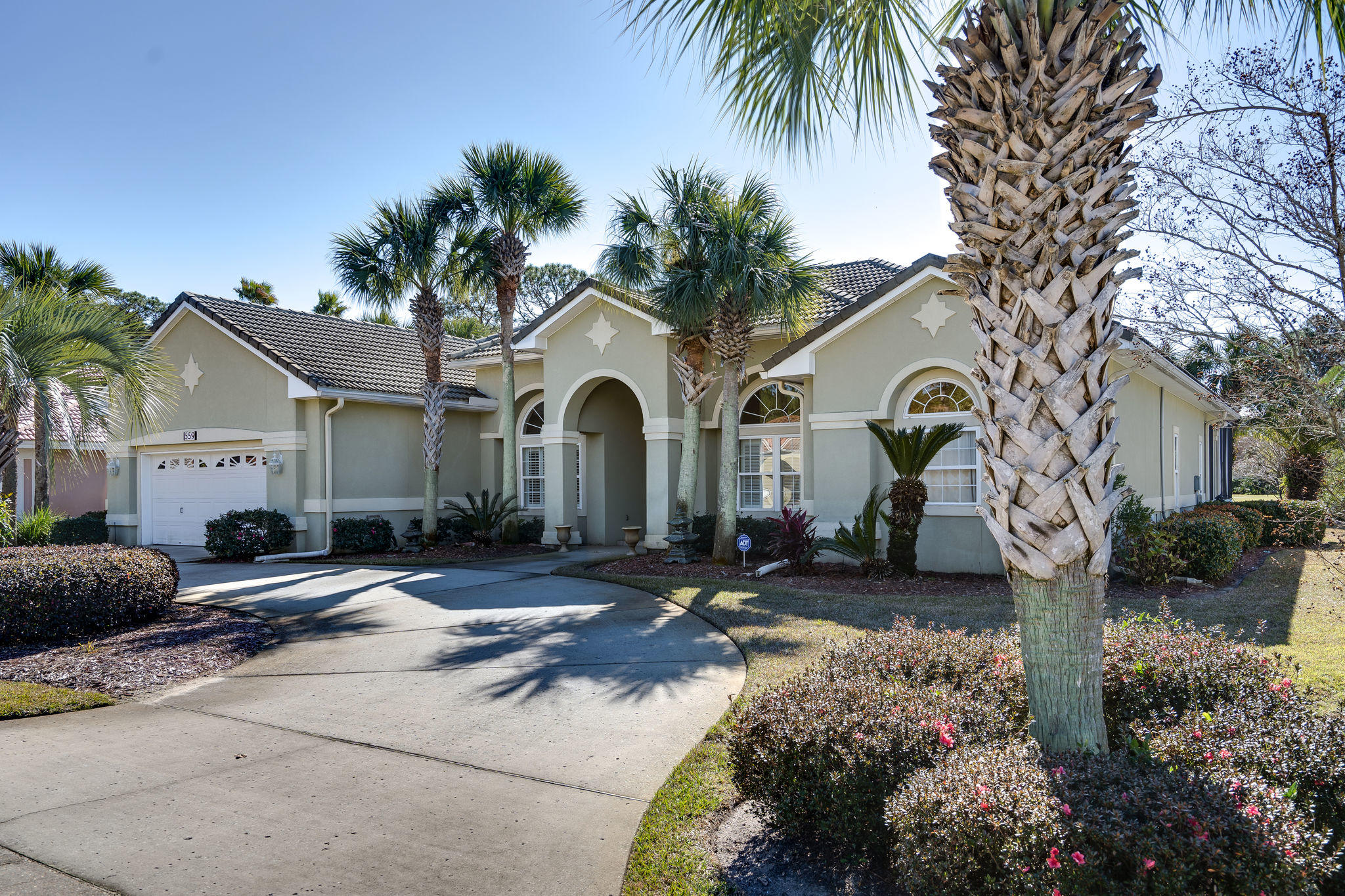 This updated, 3 bedroom + office (or 4 bedroom), 3 bath, single story, contemporary, custom built home is located in the prestigious, gated, golf-community of Emerald Bay. The grand foyer, coffered & trey ceilings, crown molding and beautiful arches and columns perfectly accentuate the open & airy floor plan. From the cozy family room with a gas fireplace you'll enjoy a great view of the beautiful screened lanai, heated pool & hot tub. In the immaculate kitchen you will find custom cabinetry, quartz countertops, a gas Jenn-Air cooktop with downdraft ventilation, GE profile stainless appliances and an island with a built-in microwave. The master bedroom and en suite bathroom features a whirlpool tub and double vanities. (READ MORE)