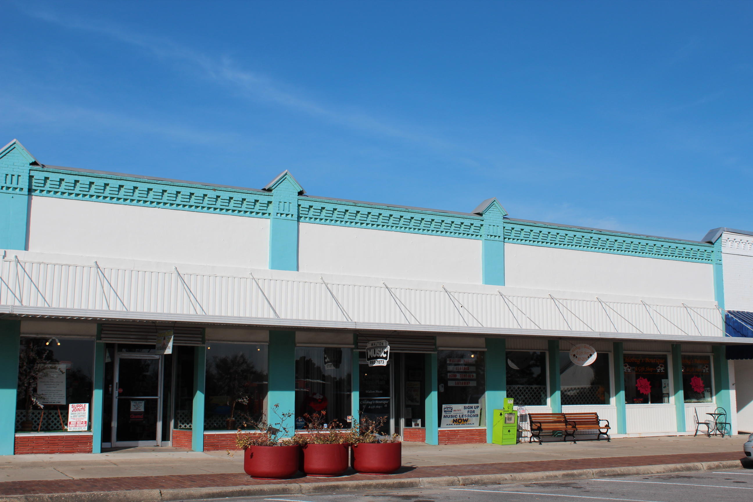 Attention commercial property investors. Known as The Downtown Mini Mall,this listing includes under one roof a total of five commercial rentals. 8,697 S.F. under roof. Aproximately 6716 S.F. is heated & cooled. As of 2/1/15 four of the five commercial rental offices. The building had a new A/C system installed on or about 2012. A new metal roof was installed on or about 1998.