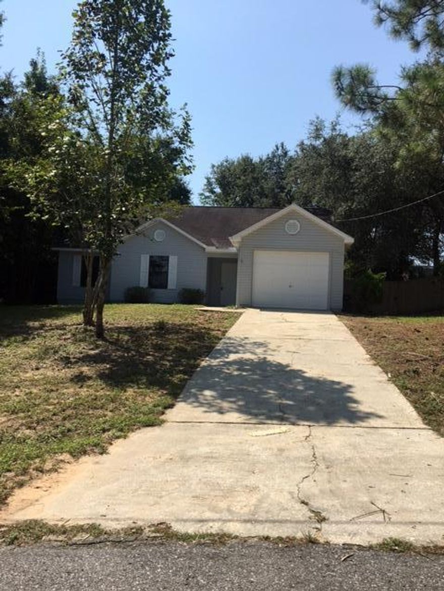 Charming 3 bedroom 2 bath home for sale in Crestview! This property features fresh paint, beautful dark laminate floors, new carpets in the bedrooms, and more! Updated kitchen with stainless steel appliances. One car garage. Roomy back yard with open patio off of the living room. This house is also getting a BRAND NEW ROOF! Scheduled to go on within the next or so. This move-in ready property won't last long, show today!