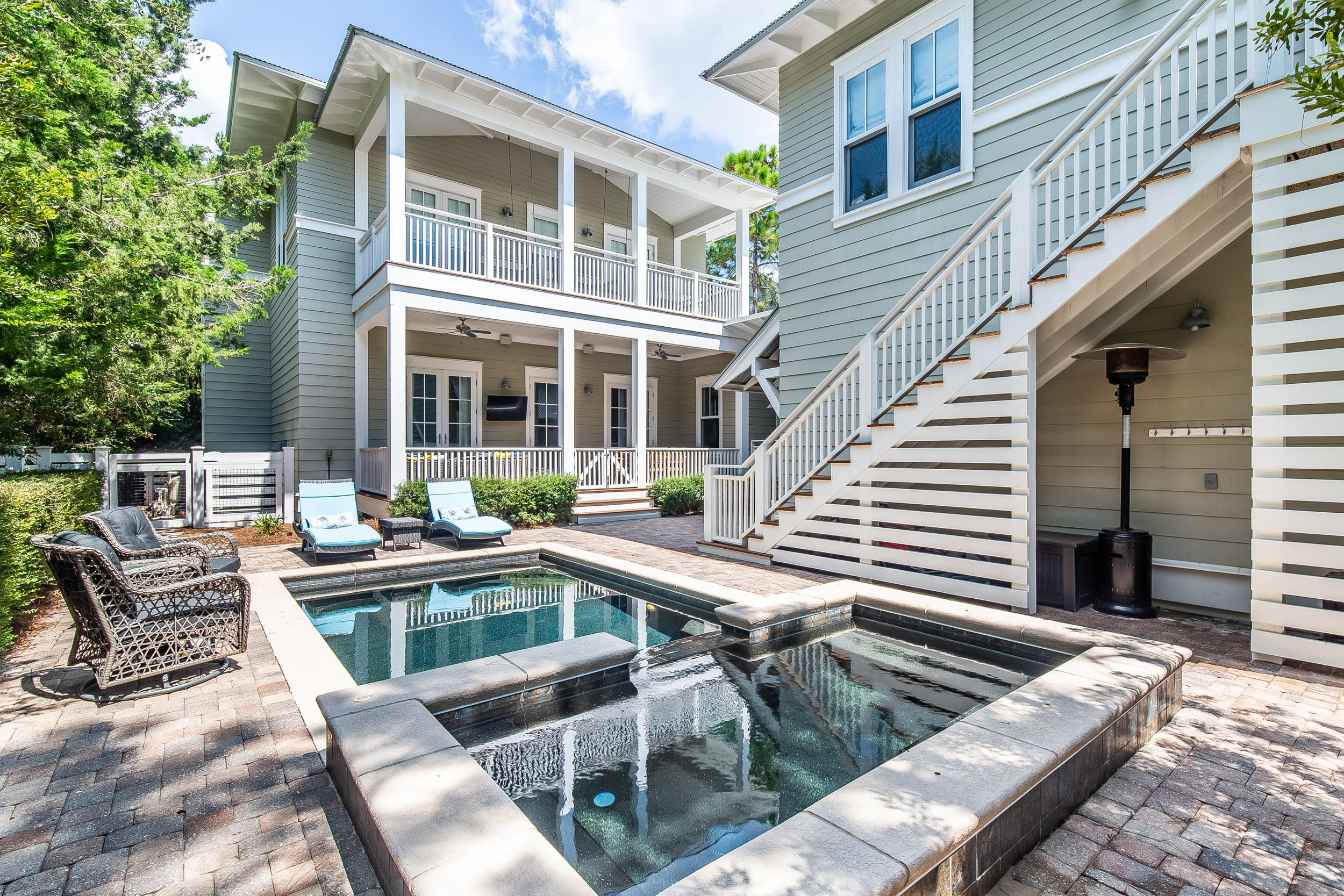 This beautiful Watercolor home on a tucked away street greets you with a large covered front porch. Enter the home and you'll immediately notice the gorgeous white washed oak floors, antique Chicago brick walls, marble countertops and overall outstanding finishes throughout. The custom kitchen includes Thermador appliances, built-in coffee machine, two dishwashers, warming drawer and an expansive island. Look out from the kitchen and living area onto the private backyard that includes a pool, spa and outdoor living area that's ready for entertaining. Separate carriage house includes 1 bedroom, living area, and large bathroom. This turnkey home is being sold fully furnished.
