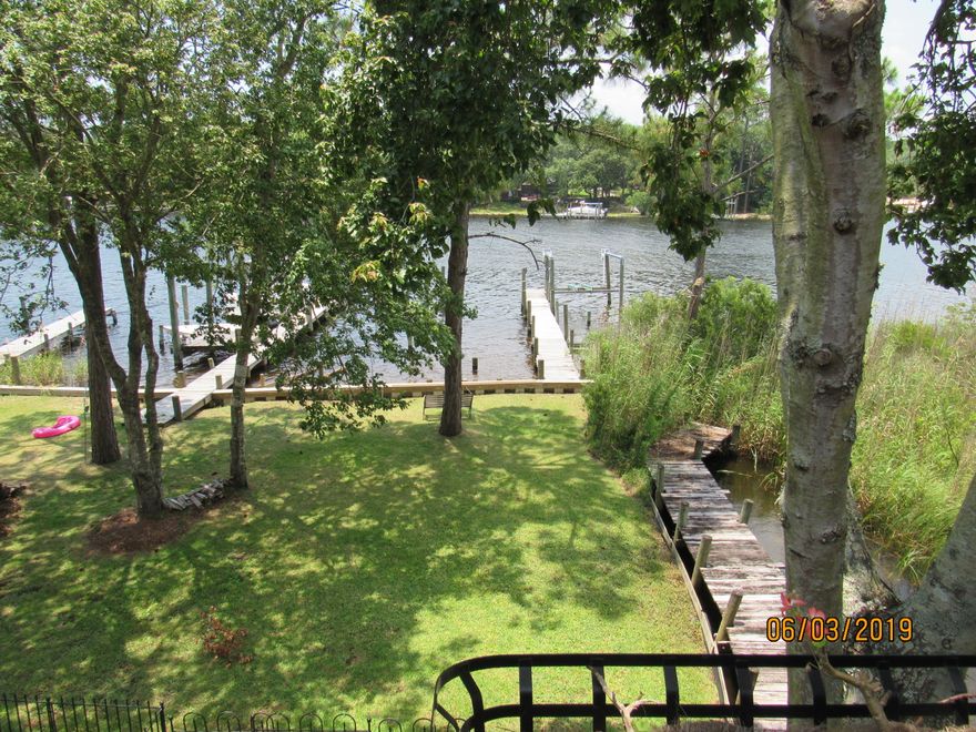Got a boat? This waterfront, 3 bedroom, 2 bath town home with private dock (both sides), including 6500lb lift may be perfect for you! On the first floor is the huge master bedroom which has its own bath and its own balcony overlooking the water, as well as a guest bedroom and the laundry. Upstairs, there is a spacious living room with bamboo flooring and a sliding glass door leading out to another spacious waterfront balcony as well as an updated/upgraded kitchen with breakfast bar, granite counter tops, and a beautiful backsplash, as well as a third bedroom and a guest bath. Pets may be considered on a case by case basis. No smoking.