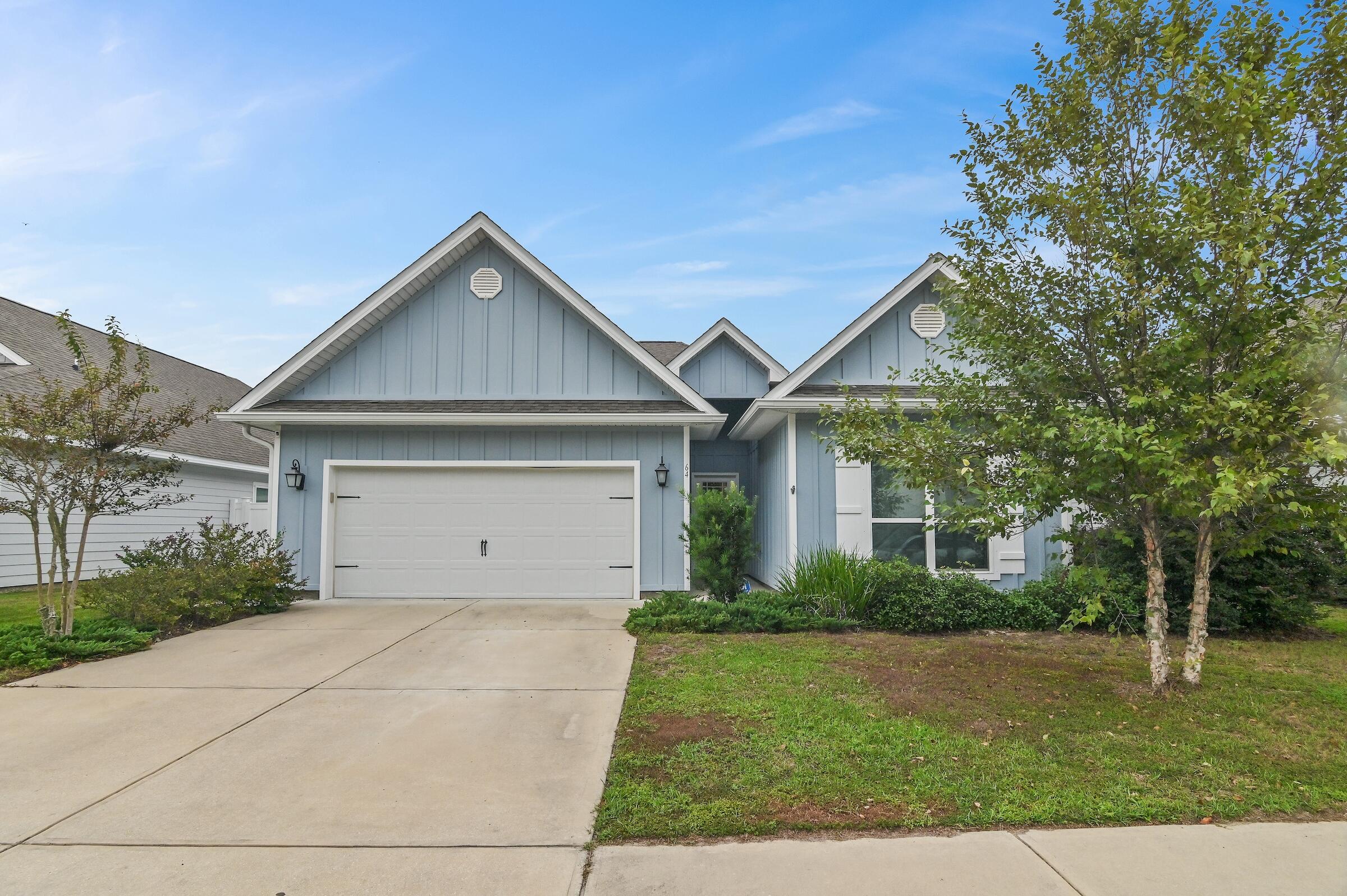 Discover this like-new multi-generational home, perfectly located in sought-after Santa Rosa Beach. Spanning 2,122 sq. ft., this property includes a spacious 3-bedroom, 2-bath main residence and a private 1-bedroom, 1-bath lock-off suite, offering flexibility for extended family, guests, or long-term rental opportunities.Inside, enjoy an open floor plan that seamlessly blends living and dining areas--ideal for both relaxation and entertaining. The kitchen boasts smart appliances, granite countertops, and plentiful workspace, appealing to home cooks and hosts alike. The primary suite is a serene retreat, complete with an ensuite bathroom featuring a soaking tub and separate shower. Two additional bedrooms provide ample space for family or a home office, along with another full bath. The standout feature of this home is the multi-generation feature, which includes a private entrance, a cozy living area, a full kitchen, a bedroom, and a full bathroom - ideal for guests, family, or as a long-term rental option. Outside, the spacious backyard offers a peaceful oasis for relaxation and outdoor gatherings, with a patio area perfect for barbecues and entertaining. Located on a 0.16-acre lot in the Stonegate neighborhood, this home provides convenient access to nearby essentials like Walmart, Publix, Grand Boulevard, and the pristine 30A beaches, only minutes away.