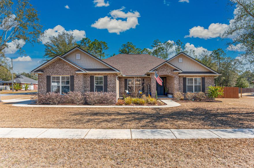 GORGEOUS CUSTOM HOME offered with all of the upgrades you could want! This 4 Bed 2 Bath home, is located on almost a half acre CORNER LOT with side entry garage in HOMEWOOD ESTATES! This home offers a wonderful open floor plan, living and kitchen space, with wonderful sized bedrooms. The natural light in this home is incredible with tons of windows and custom blinds. There are granite counter tops throughout with custom cabinetry.  Both bathrooms have double vanity sinks and are very tastefully upgraded. The home has covered front and back porches as well as open deck space for entertaining! The 12X16 custom shed is a perfect place for all of your projects! upgrades are endless!!! MUST SEE !!! *See attached upgrades list*