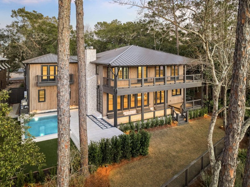 Welcome to Pointe Washington, a premier location near Scenic Hwy 30A and Eden State Park & Gardens that offers the ultimate in waterfront living. This custom designed 4,720 sq. ft. residence features 5 bedrooms, 5 full baths, and 1 half bath. Situated among mature live oaks on Tucker Bayou, the property serves as a private retreat complete with a heated pool, outdoor fireplace, dock, boat house, and a custom sliding door opening to the waterfront porch & outdoor dining that overlooks Tucker Bayou which leads to the Choctawhatchee Bay. The interior showcases exceptional craftsmanship, including an entry hall wrapped in shiplap with immediate water views, a custom steel and glass entry door, ceiling beams, Italian limestone and Appalachian white oak floors. The main level is designed for entertaining with a seamless flow between the kitchen, dining, and living areas. Custom milled white oak cabinetry, Sub-Zero appliances, antique mirrors with shellstone countertops give dream kitchen vibes. The upper level includes a primary suite with water views from the expansive doors and windows that open to the full length private balcony, two walk-in closets, and a spa inspired bath with soaking tub, walk in shower and direct laundry room access. Additionally, a secondary living space provides a lounge area for your guest with wet bar, ice maker and beverage refrigerator. A carriage house accessible from within the home and from the garage below, features a West facing balcony overlooking the pool and Tucker Bayou. Located within a short distance to 30A and the beaches of South Walton, providing exclusive dining, shopping and entertainment. This home defines luxury and relaxation.