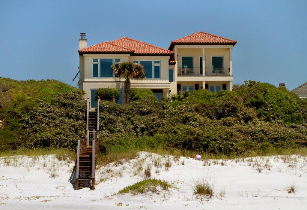 From its Gulf front vantage point 36 feet above sea level, this inheritable home presides over a truly rare and enviable vista that captures both an extremely deep beach, as well as the confluence of the Gulf of Mexico and Big Redfish Lake. Big Redfish Lake is one of only 15 coastal dune lakes found along Scenic Highway 30A in South Walton, one of but a few locations worldwide that include the island of Madagascar, Australia, New Zealand, and Oregon where such natural phenomena occur.