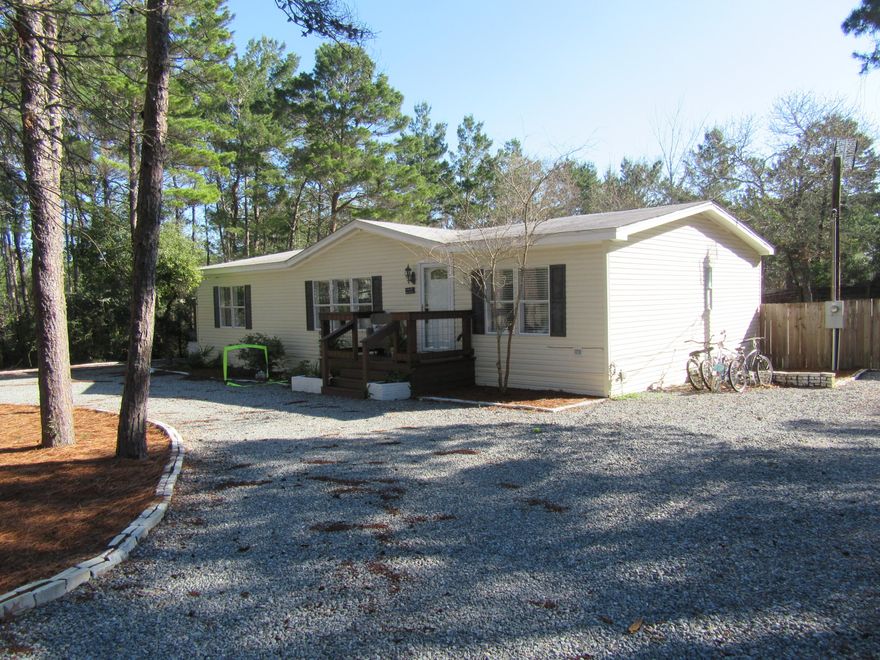 GREAT chance to own in beautiful Inlet Beach for unbelievable price. Large lot. A short walk to Lake Powell and a minute away from the beach. Awesome location, close to everything, shopping restaurants, beach, paddle boarding/kayak , etc. Home is upgraded & very well maintained. Call for a viewing. Also the adjoining lot is for sale mls 815691