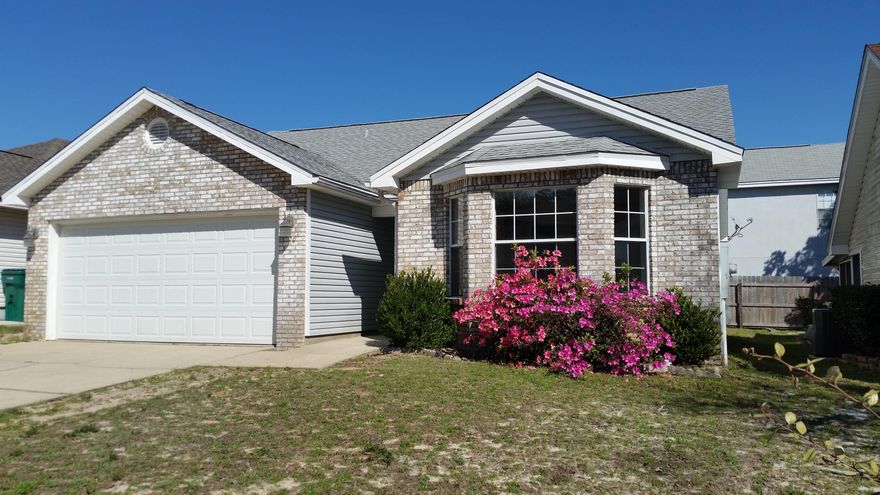 Darling home, ready to move into just 5 miles West of Hurlburt Field Air Force Base. Freshly painted interior, brick and vinyl exterior for easy maintenance. Large greatroom with cathedral ceiling has double french doors leading to 8X20 screened porch. Bright kitchen offers smooth top stove, breakfast bar and opens to dining area. Cheerful master bedroom with bay window for good natural light. Master bath boast a garden tub with transom window above and dual vanities. Pretty tile throughout the home. Ceiling fans in all bedrooms, greatroom and dining area. The 2 car garage has pull down stairs for attic access, laundry tub, newer door and new garage door opener. Seller says the HVAC was replaced about 4 years ago. According to Okaloosa permitting, looks like roof was done in 2008.
