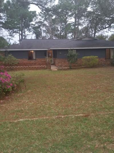 REO - Handyman special four bedroom home situated on over a half acre of beautiful wooded land. The residence offers 1,848 sf of living space with a spacious family room w/fireplace, an open concept kitchen w/breakfast bar, formal dining room and French doors that open onto a large screened Lanai. The property has several out buildings including a workshop/storage space. Located minutes from Hurlburt Field & the sandy white Gulf beaches! All Information recorded in the MLS is intended to be accurate but cannot be guaranteed, buyer advised to verify. Sold As-Is. No utilities will be turned on to this property and only cash offers with 0 day inspection period will be considered. Buyer should perform their due diligence/necessary inspections before submitting an offer.