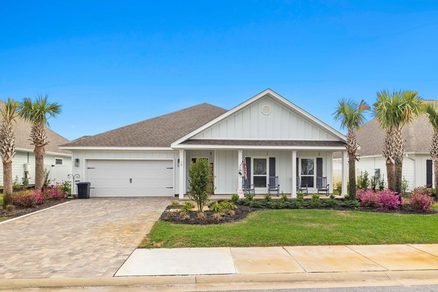 Welcome to 70 Palmview Lane, a newly built home nestled on a prime rear lot in the charming, gated Lakeview neighborhood - primely located south of Highway 98 and  a quick bike/golf cart ride from the beaches of 30A.  This home boasts the Victoria floor plan which is open and invites natural light throughout the living/kitchen/dining areas and encompasses 4 bedrooms, 2.5 baths, and a 2-car garage with an added walk-up storage area above.