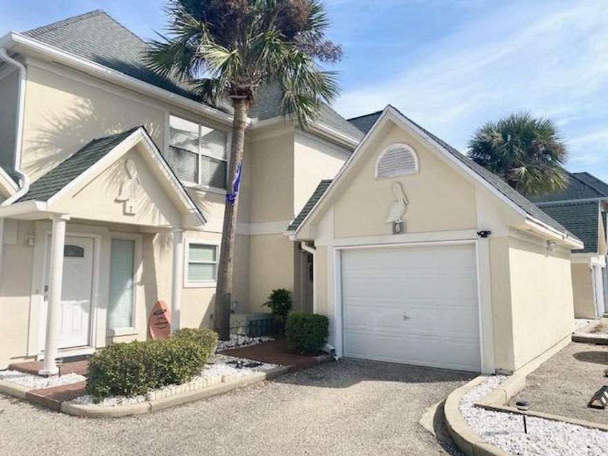 Location, location, location! Beautifully updated townhome a short distance from the desirable Destin Harbor. Open kitchen/dining/living combo, great for entertaining. Wet bar & 1/2 bath downstairs. LVP flooring throughout & tile in the bathrooms, no carpet!  Kitchen updated w/ granite counter tops, stainless steel appliances & tiled backsplash. Kitchen also has a pantry & breakfast bar. Cathedral ceilings in the master bedroom w/ a custom designed walk in closet w/ nice built ins. Ceiling fans in all the rooms. Covered back patio w/ lush flower beds. Covered front entrance w/ a detached 1 car garage w/ auto opener & attic storage w/ pull down stairs. Community pool for you to enjoy! Refrigerator, washer & dryer do not convey. Call today, this one wont last long! It is absolutely stunning!
