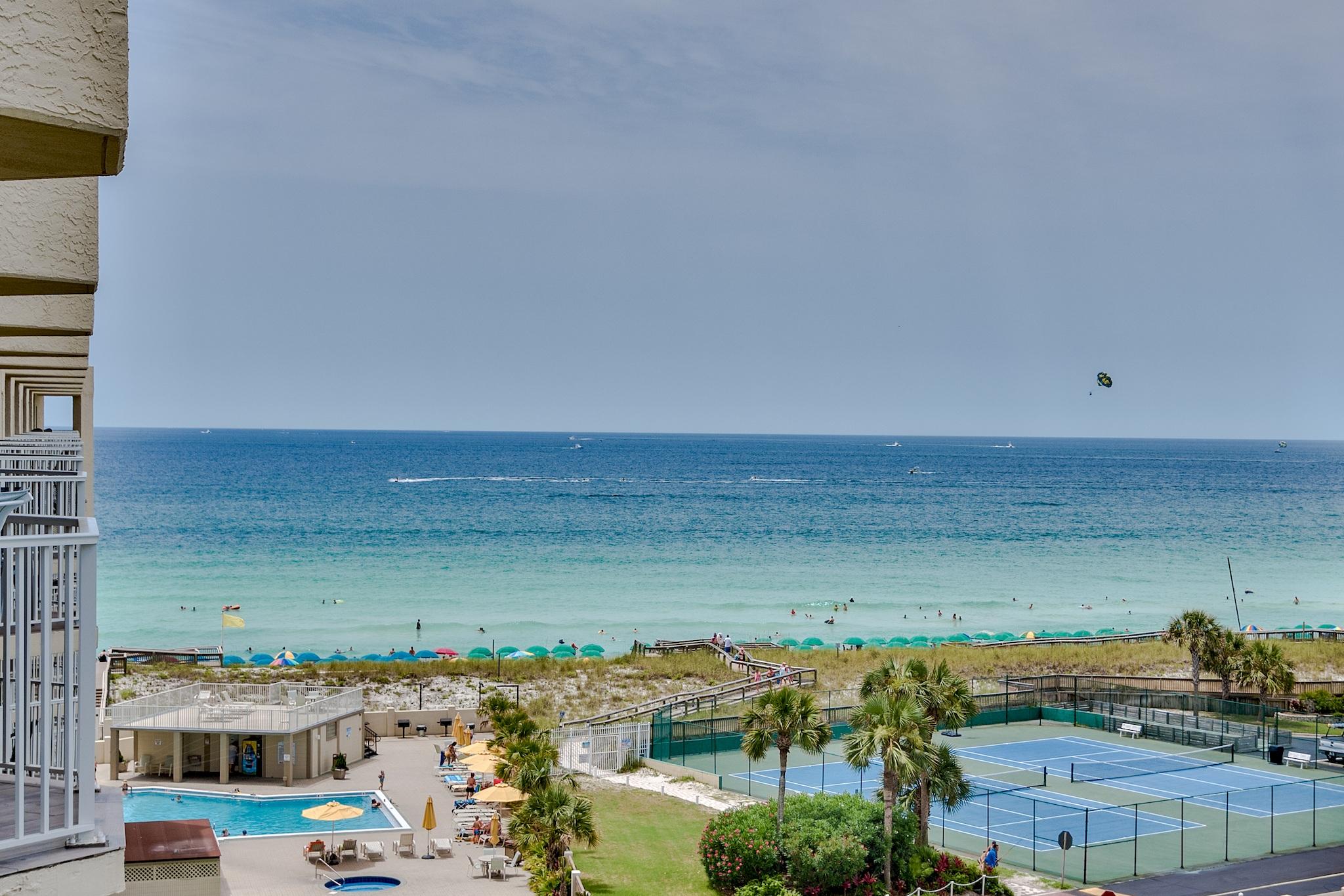 Turnkey top floor, corner unit with sweeping views of the Gulf, Destin Harbor, Eastern Pass, and the Bay. Catch sunrises from the newly-furnished breakfast nook and take in sunsets from the living room, master bedroom, and balcony.This unit has just been fully renovated, now boasting an open concept floor plan, quartz countertops throughout, marble tile in the walk-in master shower, brand new kitchen appliances, new plumbing fixtures, new lighting fixtures, and new furniture.Sold fully furnished, this condo embodies a turnkey property and is the most beautiful, most updated unit on the market on Holiday Isle.$60K in projected rental revenue.