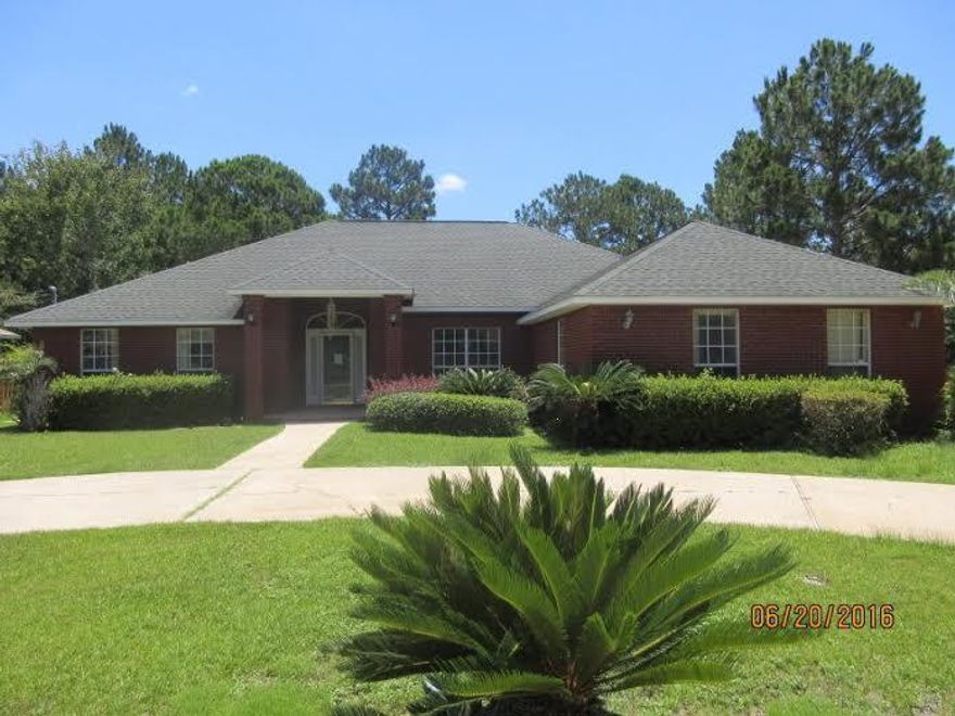 REO...All brick exterior with side entry garage. New appliances. New HVAC. New carpet. Interior freshly painted. Enjoy all the benefits of living in Holley by the Sea. Corner lot. DON'T WAIT...YOU'LL BE TOOO LATE!!!