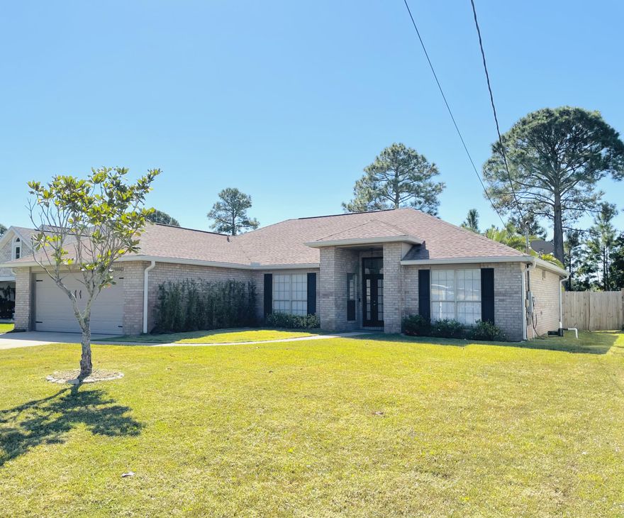 Renovated all Brick Home is waiting for a new Owner. Centrally located in Miramar, close to shopping, beaches, boat ramps, restaurants, golf courses and more. You do not want to miss out on this spacious 3 bedroom 2 bath split floorpan home. As you enter through the open foyer you are greeted by a large Great room complete with formal dining space, Kitchen with eat in breakfast space and living room.  The kitchen boasts Custom Cabinets a huge island complete with quartz countertops, stainless steel appliances and breakfast bar. Move onto the Primary Bedroom complete with hardwood floors and expansive attached ensuite. Renovated with double vanity and tile shower. Walk in closet as well. The other 2 bedrooms are on the other side of the house split by a full bathroom. Head outside to entertain your guests under the hardscaped gazebo, large yard, and open patio. Lush landscaping and double gate complete this large beautiful yard. 