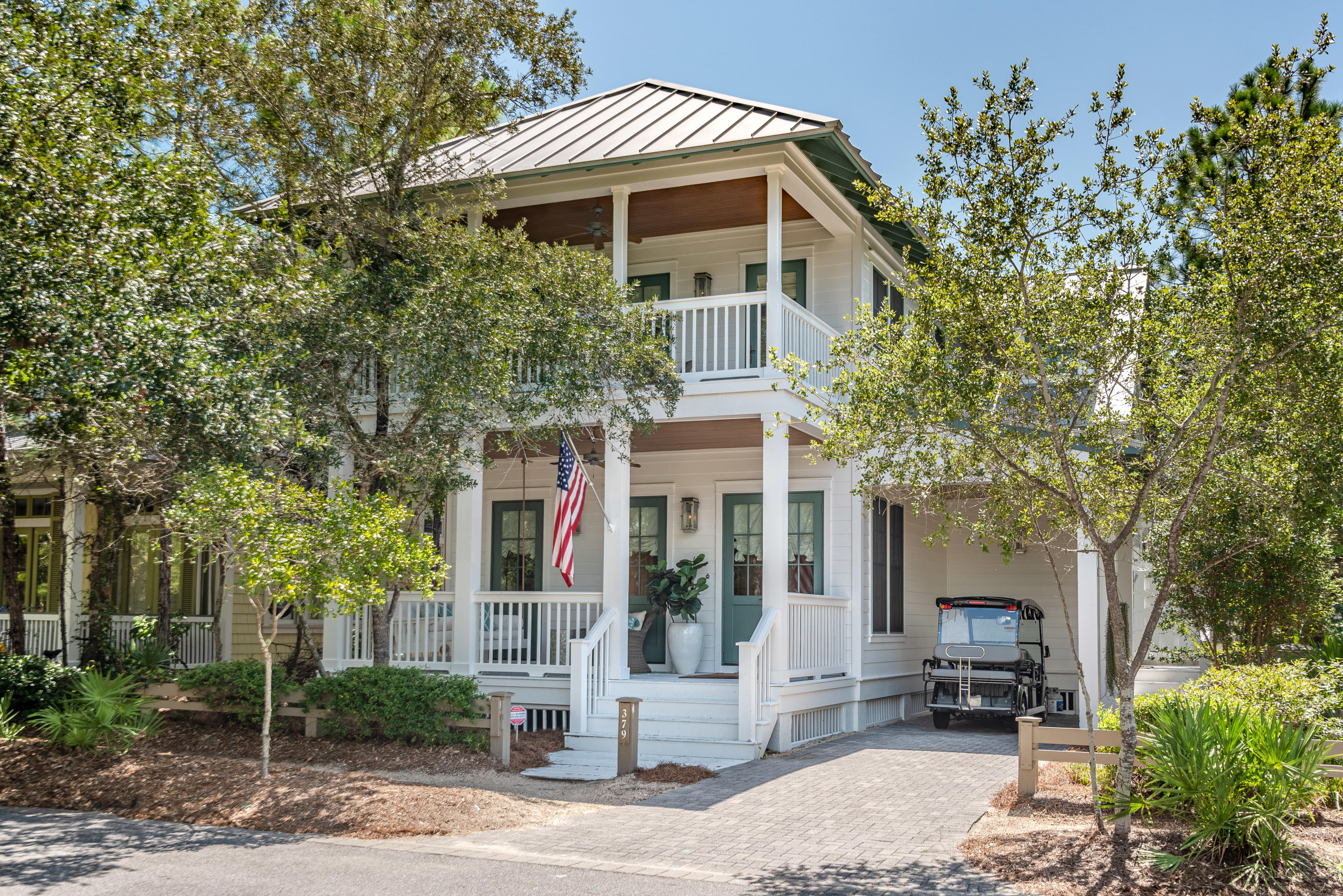 It would be difficult to find a more perfect location for family fun in WaterColor.  Overlooking a beautiful reflecting pond, the soccer field, and with views of the Camp WaterColor pool, 379 Spartina represents carefree living at its finest.  Four bedrooms across 3,100 square feet provide generous and inviting comfort for guests.  The spacious master suite, with its spa-style bathroom, sitting area, and gas burning fireplace, is an owner's retreat rare for the communityA summer kitchen is located on one of the home's 4 porches and balconies.  The porch off of the main area extends living space outward to the surrounding park and preserve.  Mature landscaping, meanwhile, provides privacy for this home that would otherwise be center stage.  379 Spartina is a crowd pleaser.