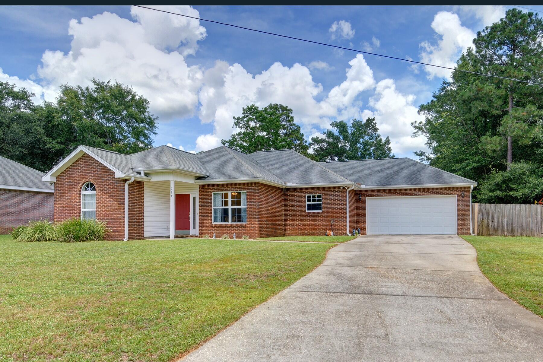 Welcome home to this brick beauty featuring 3 bedrooms, 2 baths plus a massive 15x19 bonus room! This conveniently located custom home has all the finishes you've been looking for! Enter inside and appreciate the open concept design with an expansive trey ceiling stretching the entire living and dining space. This desirable split floor plan has a master bedroom with private master bath and two additional bedrooms with guest bath in between. The kitchen features lovely granite countertops with tasteful backsplash and stainless appliances that lead to a large interior laundry room off the two car garage. Through the living room your jaw will drop at the massive bonus room - the possibilities are endless in this space! The backyard is completely privacy fenced with a playground set that stays