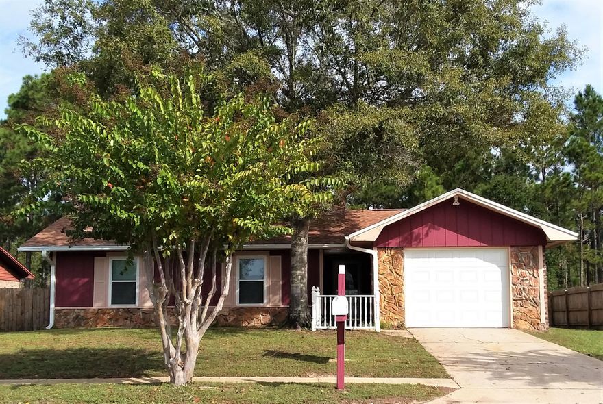 This home is a must see! Just completed being remodeled with New roof- June 2019, floors, paint, trim, light fixtures, doors and much more. The living room has beautiful vaulted ceilings with a stone accented fireplace and freshly refinished mantle just in time for the holidays. The kitchen features new easy close cabinets, granite counter tops, inset sink and faucet, new dishwasher and microwave. Fridge is 1y old. The dinning room has a great view of the lanai/covered screened in porch and views of the Quiet back yard through the energy efficient Sliding door (2016) New floor, paint, vanities, mirrors, and fixtures in both bathrooms. New insulated Garage door. All Windows replaced in 2005, a/c in 2004. This home wont last long!! Schedule your showing today.